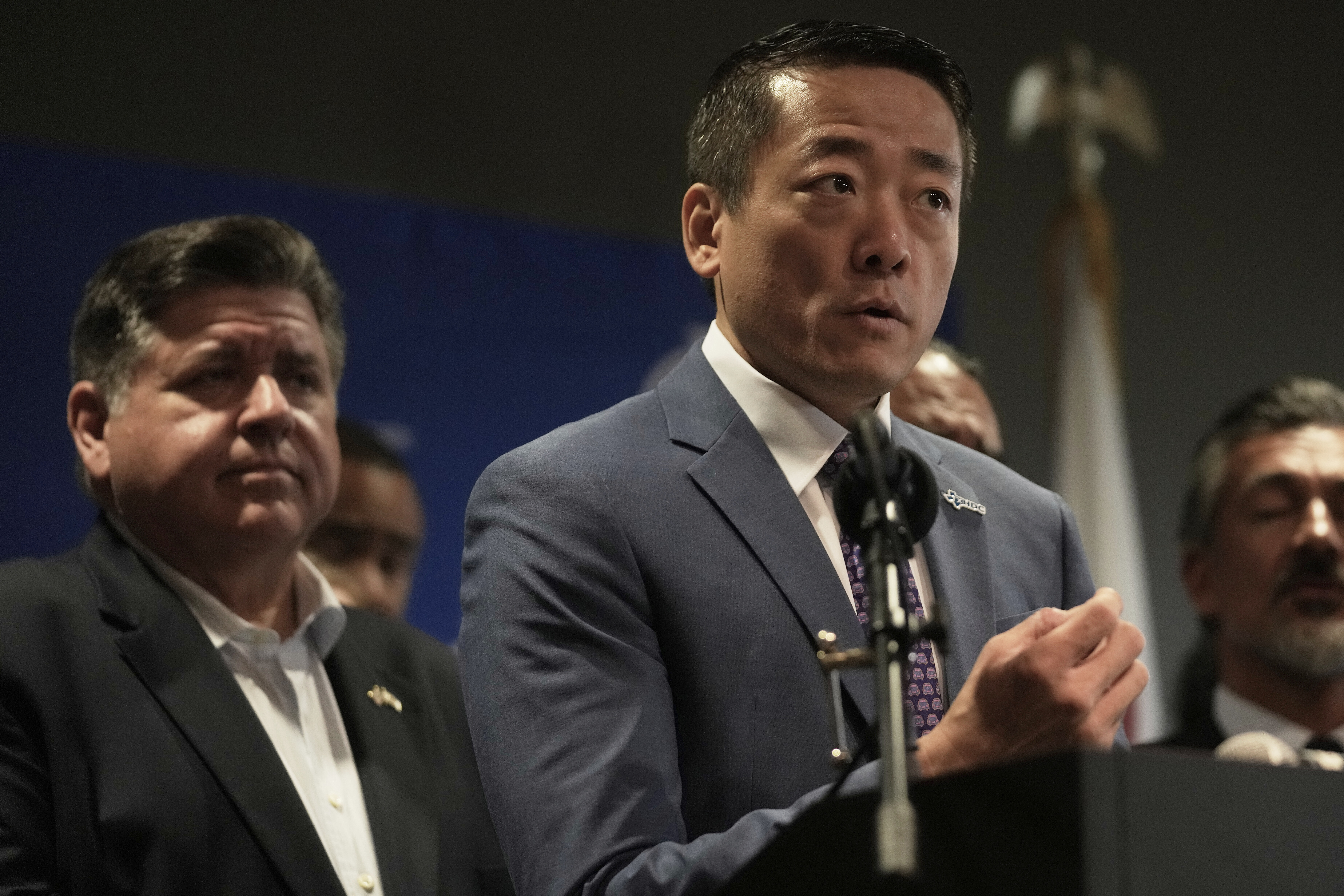 CORRECTS CITY TO AURORA, ILL., Texas Rep. Gene Wu speaks as Illinois Governor JB Pritzker looks on during a news conference in Aurora, Ill,, on Tuesday, Aug 5, 2025. (AP Photo/Erin Hooley)