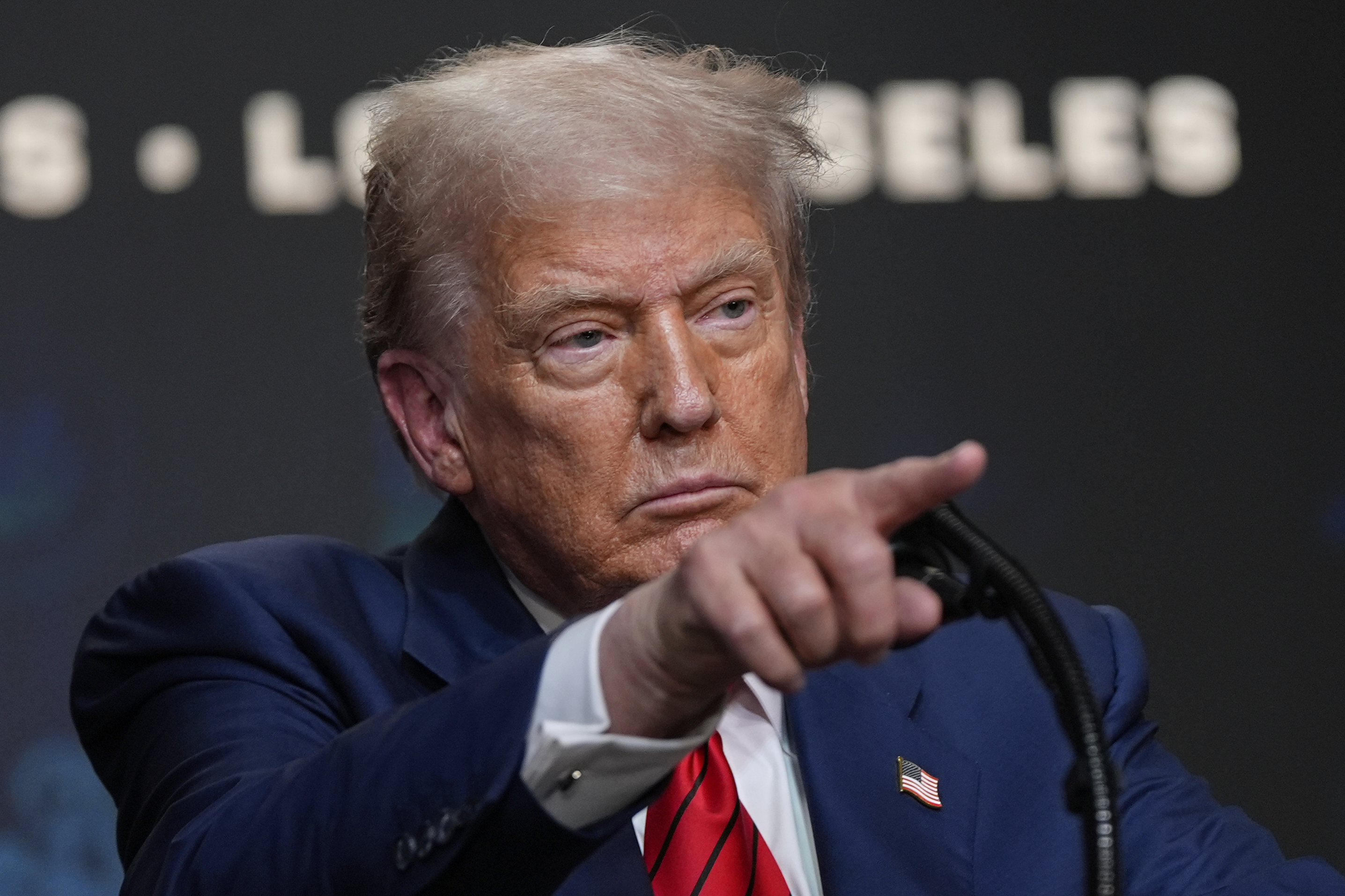 President Donald Trump speaks before signing an executive order about the 2028 Los Angeles Olympic Games, in the South Court Auditorium of the Eisenhower Executive Office Building on the White House campus, Tuesday, Aug. 5, 2025, in Washington. (AP Photo/Julia Demaree Nikhinson)