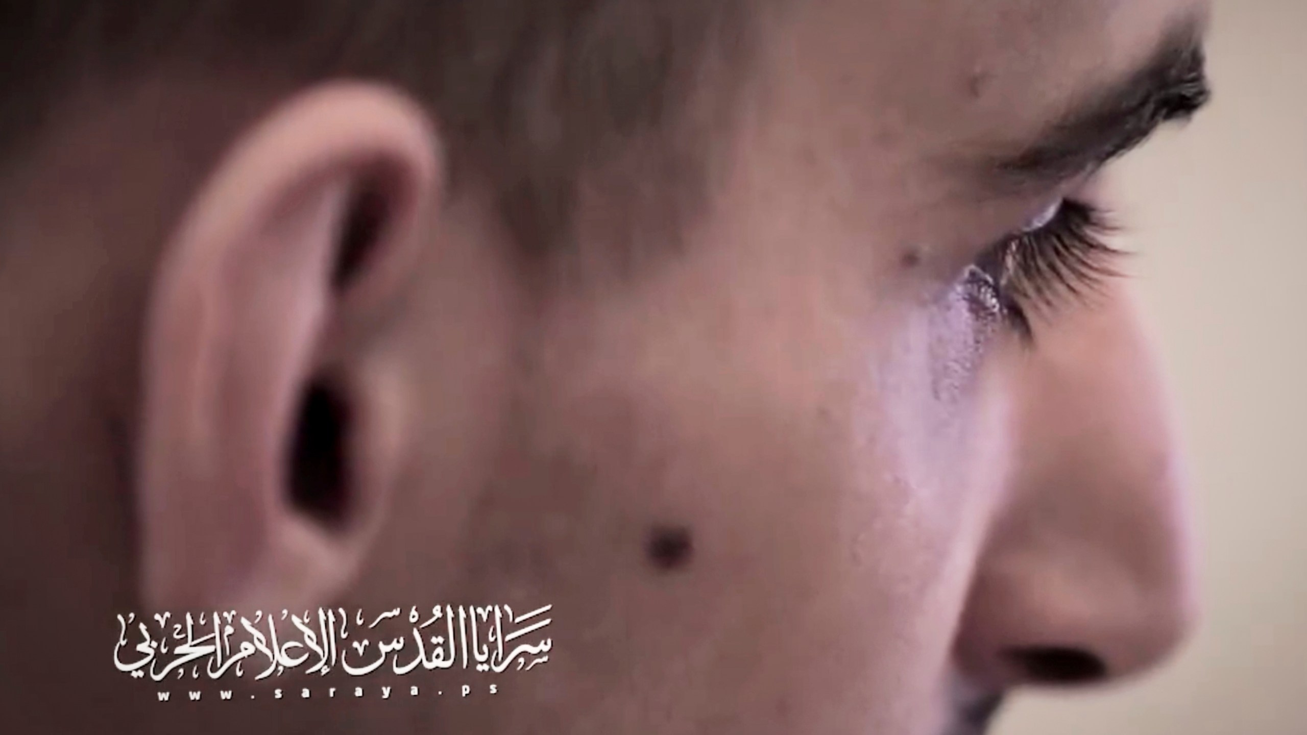 This screengrab from an undated video, released on July 31, 2025, by the Islamic Jihad militant group, shows Israeli hostage Rom Braslavsky while being filmed by his captors at an undisclosed location in the Gaza Strip. Braslavsky was abducted during the Hamas-led attack on October 7, 2023. Bottom left reads in Arabic "Al-Quds Brigades, war media."(Islamic Jihad via AP)