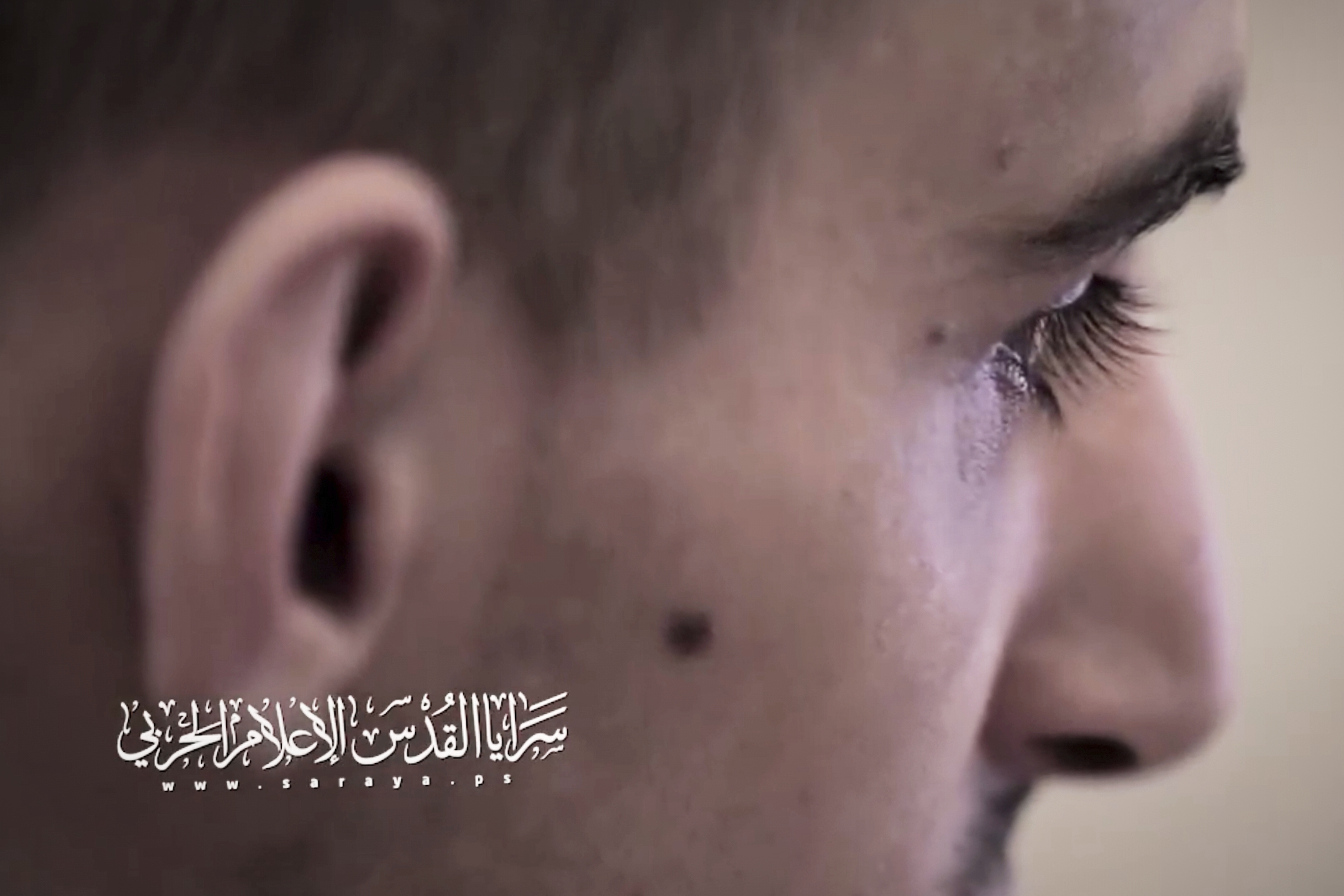 This screengrab from an undated video, released on July 31, 2025, by the Islamic Jihad militant group, shows Israeli hostage Rom Braslavsky while being filmed by his captors at an undisclosed location in the Gaza Strip. Braslavsky was abducted during the Hamas-led attack on October 7, 2023. Bottom left reads in Arabic "Al-Quds Brigades, war media."(Islamic Jihad via AP)