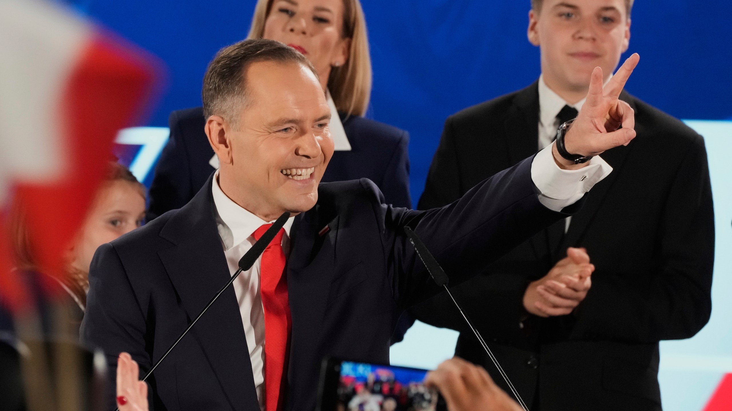 FILE - Presidential candidate Karol Nawrocki, a conservative historian backed by the right-wing Law and Justice party greets supporters as he arrives at his headquarters after the presidential election runoff in Warsaw, Poland, Sunday, June 1, 2025. (AP Photo/Czarek Sokolowski, File)