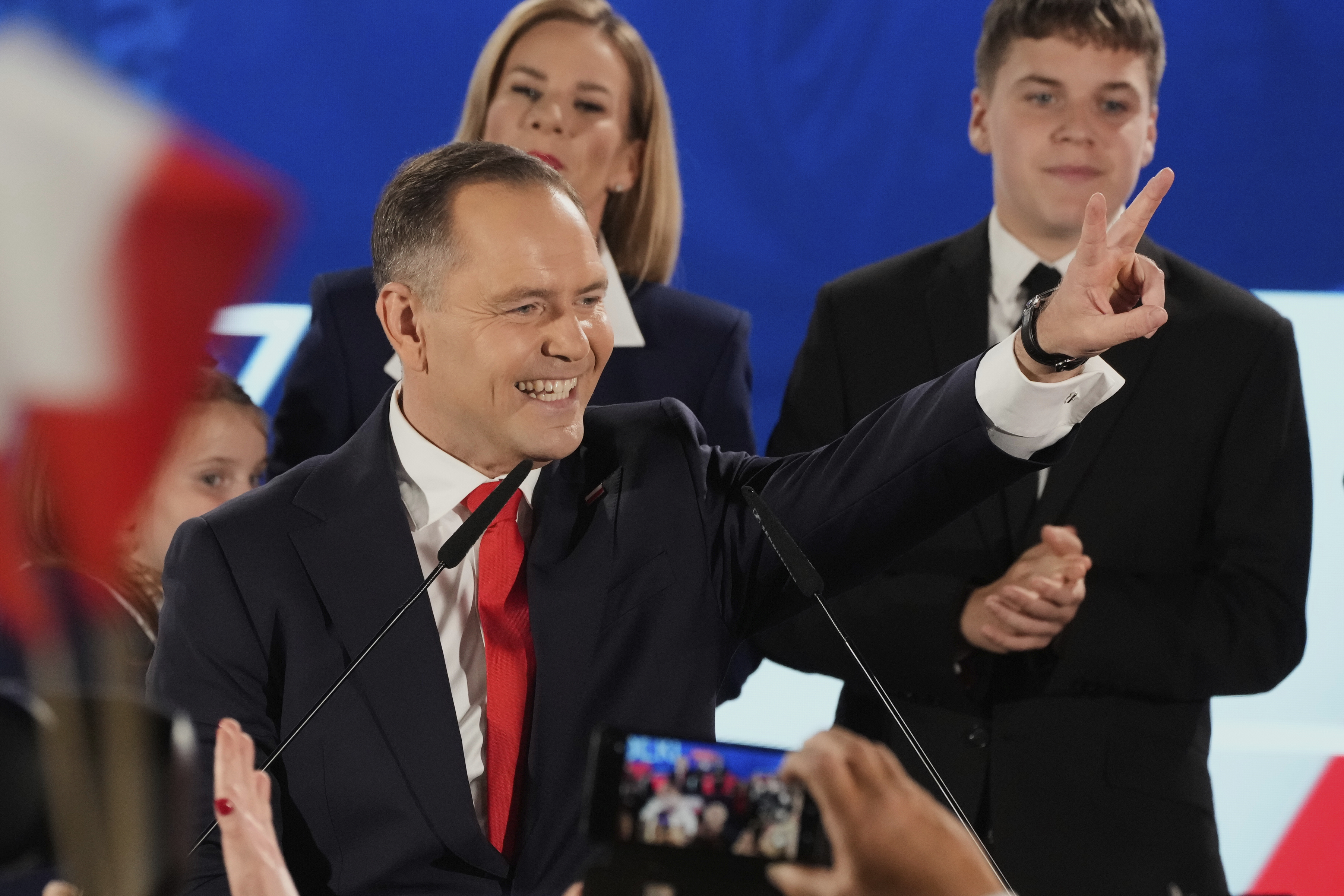 FILE - Presidential candidate Karol Nawrocki, a conservative historian backed by the right-wing Law and Justice party greets supporters as he arrives at his headquarters after the presidential election runoff in Warsaw, Poland, Sunday, June 1, 2025. (AP Photo/Czarek Sokolowski, File)