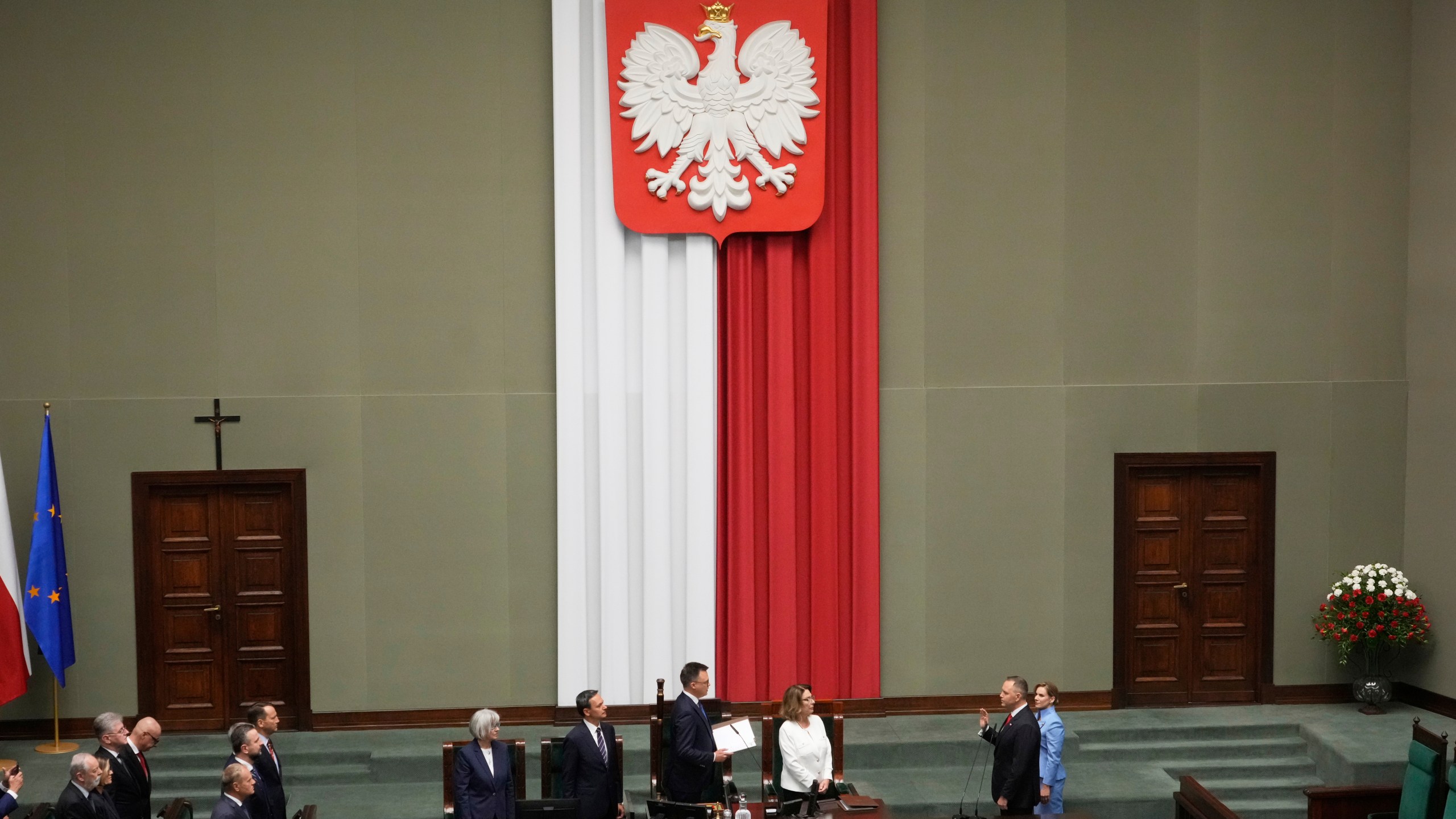 Poland's new president Karol Nawrocki takes the oath during the inauguration ceremony in Warsaw, Poland, Wednesday, Aug. 6, 2025. (AP Photo/Czarek Sokolowski)