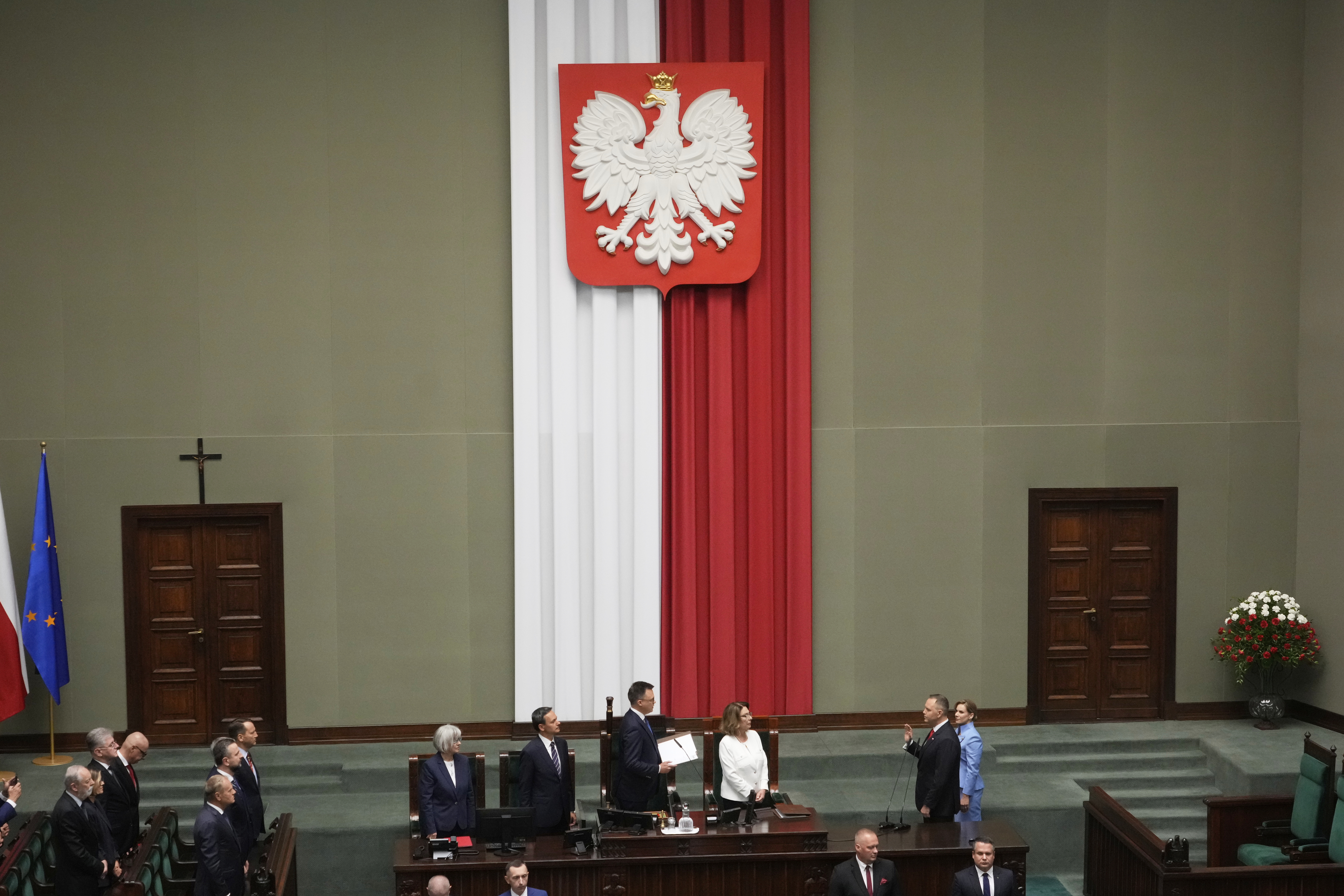 Poland's new president Karol Nawrocki takes the oath during the inauguration ceremony in Warsaw, Poland, Wednesday, Aug. 6, 2025. (AP Photo/Czarek Sokolowski)