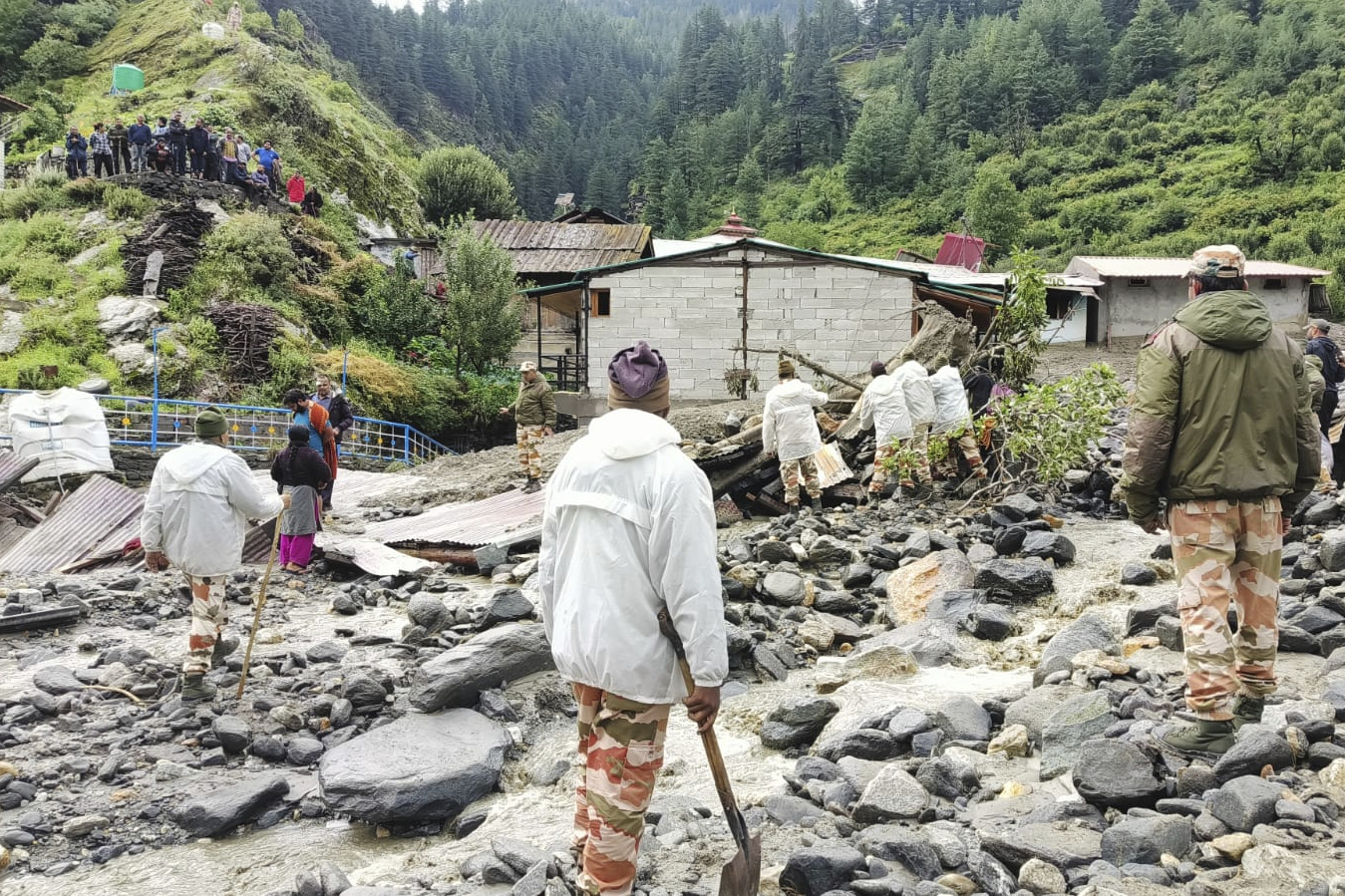 Indo Tibetan Border Police soldiers clear the debris and look for the survivors after a flash flood that swept away many houses and buildings in Dharali, a Himalayan mountain village in the Uttarkashi district of Uttarakhand state, India, Wednesday, Aug. 6, 2025. (Indo Tibetan Border Police via AP)