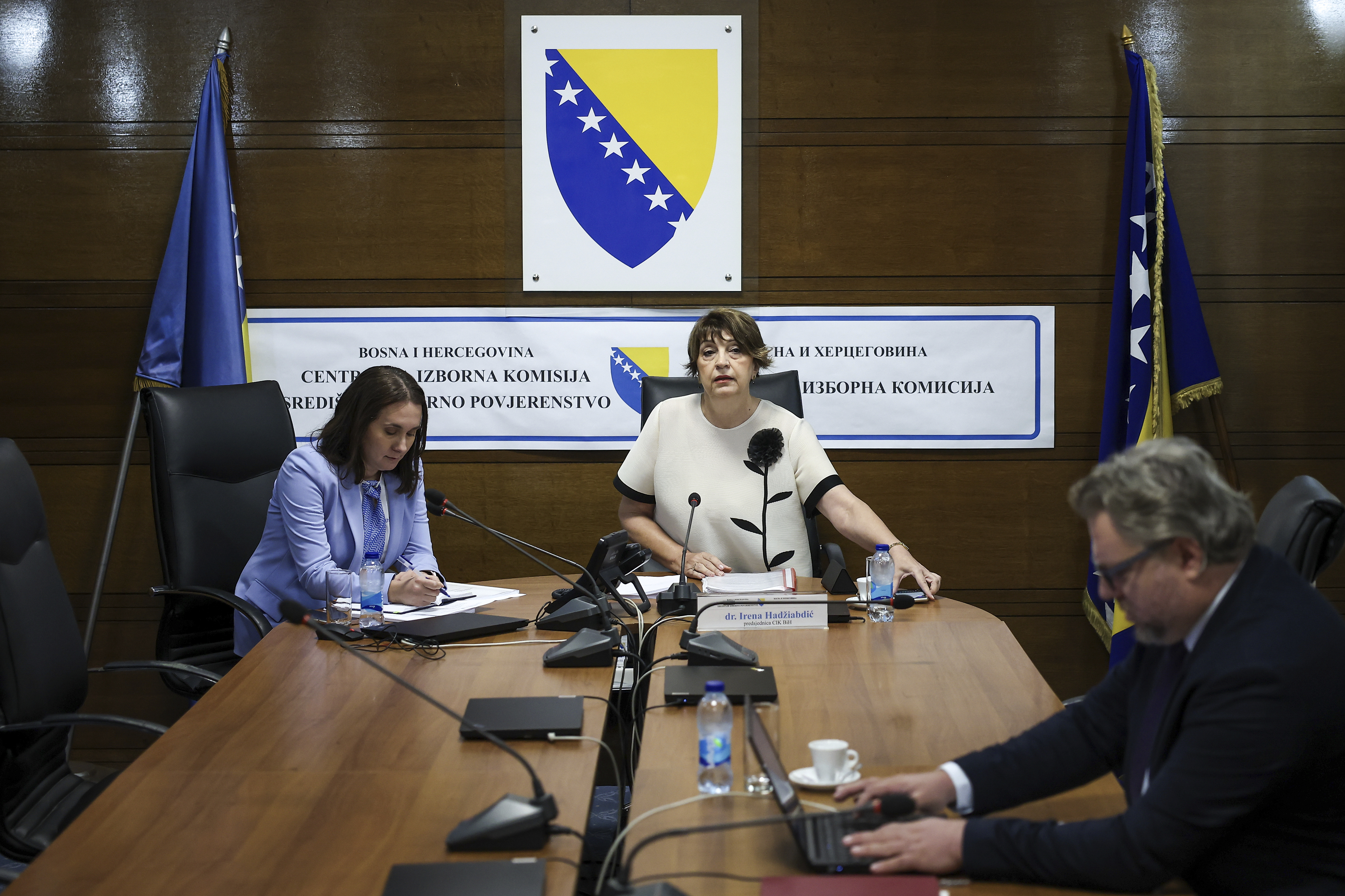 Members of the Central Election Commission of Bosnia and Herzegovina, prepare for a session discussing the potential removal of separatist Bosnian Serb leader Milorad Dodik from his position as president of the Serb entity in Bosnia, following an appeals court verdict that sentenced him to one year in jail and imposed a six-year ban on all political activities, in Sarajevo, Bosnia, Wednesday, Aug. 6, 2025. (AP Photo/Armin Durgut)