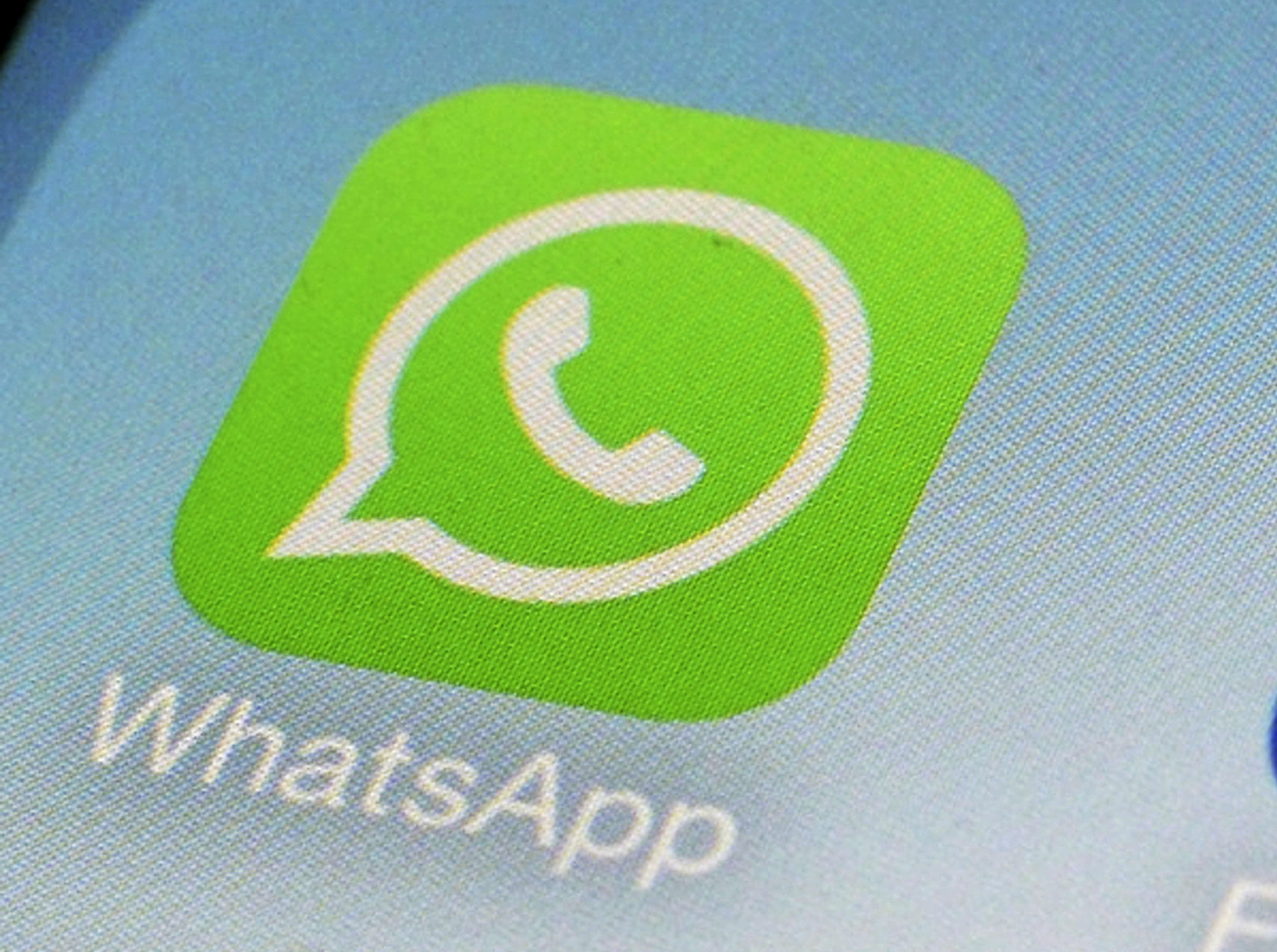 FILE - This Feb. 19, 2014, file photo, shows WhatsApp app icon on a smartphone in New York. (AP Photo/Patrick Sison, File)