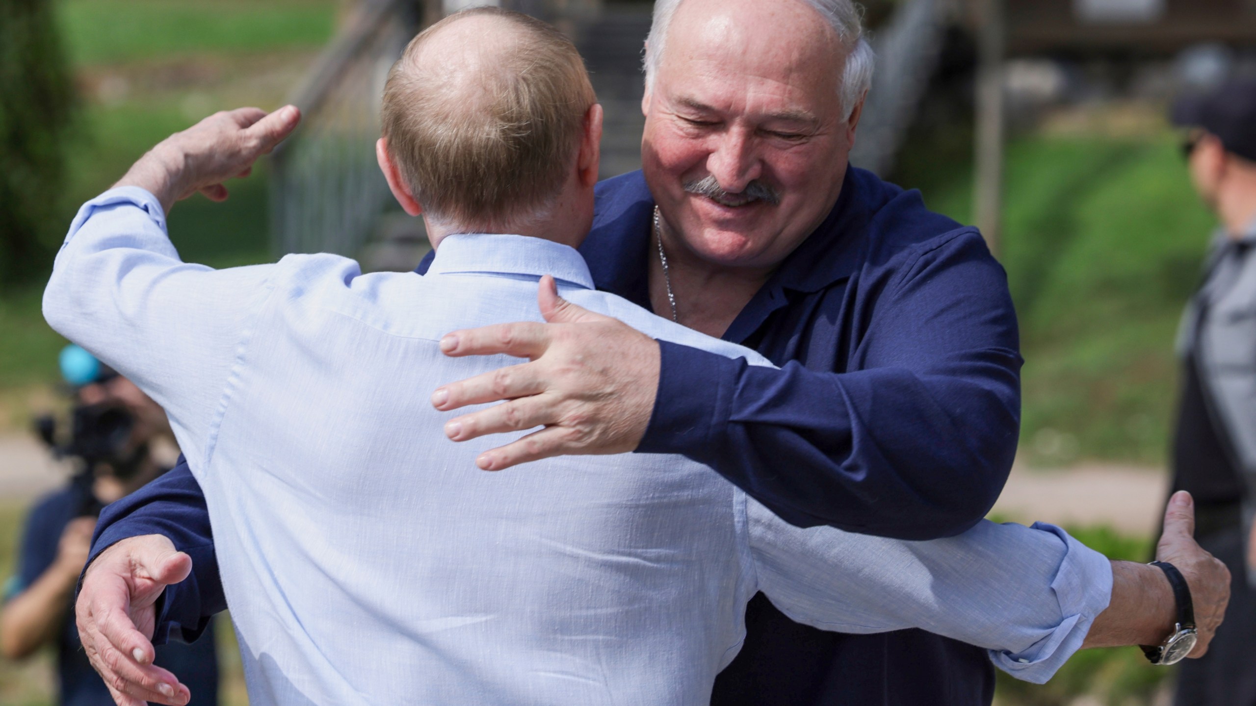 Russian President Vladimir Putin, front, embraces Belarusian President Alexander Lukashenko during their visit to the Smolensky Skete of Valaam Monastery at Valaam island in Ladoga lake, Republic of Karelia, Russia, Friday, Aug. 1, 2025. (Gavriil Grigorov, Sputnik, Kremlin Pool Photo via AP)