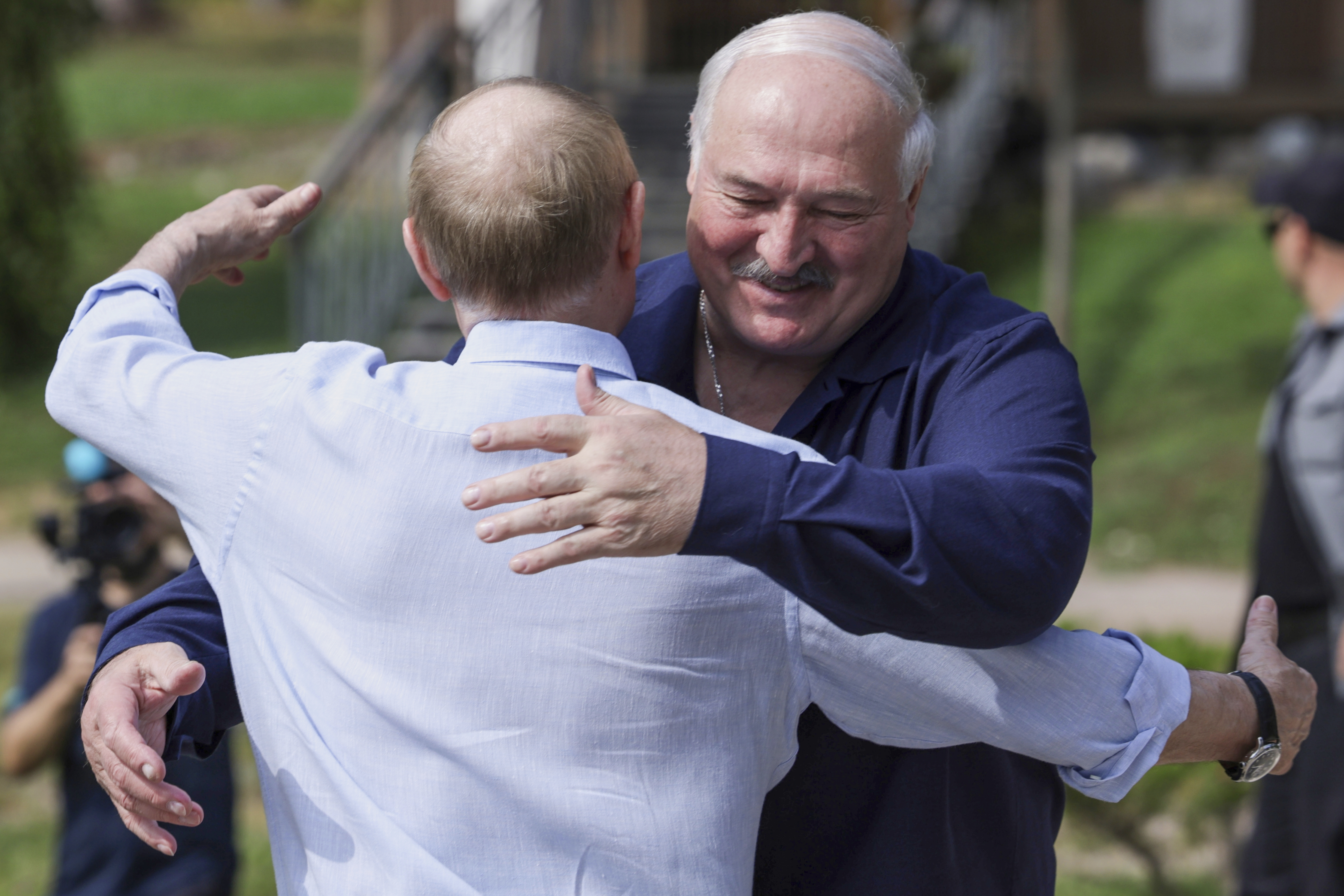 Russian President Vladimir Putin, front, embraces Belarusian President Alexander Lukashenko during their visit to the Smolensky Skete of Valaam Monastery at Valaam island in Ladoga lake, Republic of Karelia, Russia, Friday, Aug. 1, 2025. (Gavriil Grigorov, Sputnik, Kremlin Pool Photo via AP)