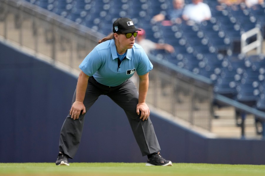 FILE - Umpire Jen Pawol takes her position during the first inning of a spring training baseball game between the St. Louis Cardinals and Washington Nationals Monday, March 4, 2024, in West Palm Beach, Fla. (AP Photo/Jeff Roberson, File)