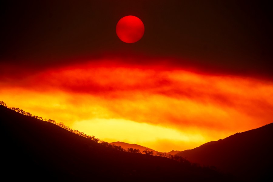 Smoke from the Gifford Fire fills the sky as the sun sets over Los Padres National Forest, Calif., on Monday, Aug. 4, 2025. (AP Photo/Noah Berger)