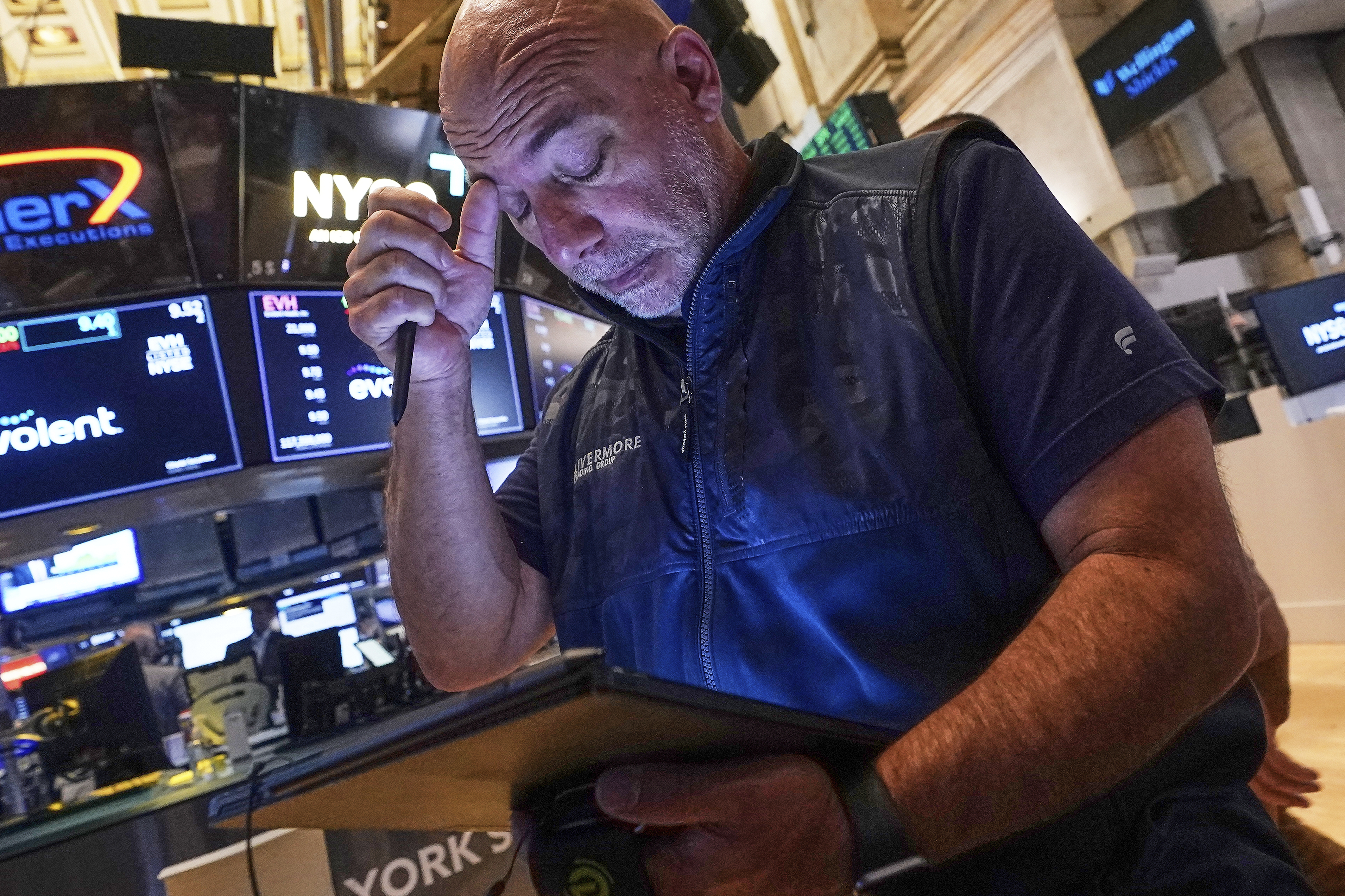 Trader Vincent Napolitano works on the floor of the New York Stock Exchange, Tuesday, July 29, 2025. (AP Photo/Richard Drew)