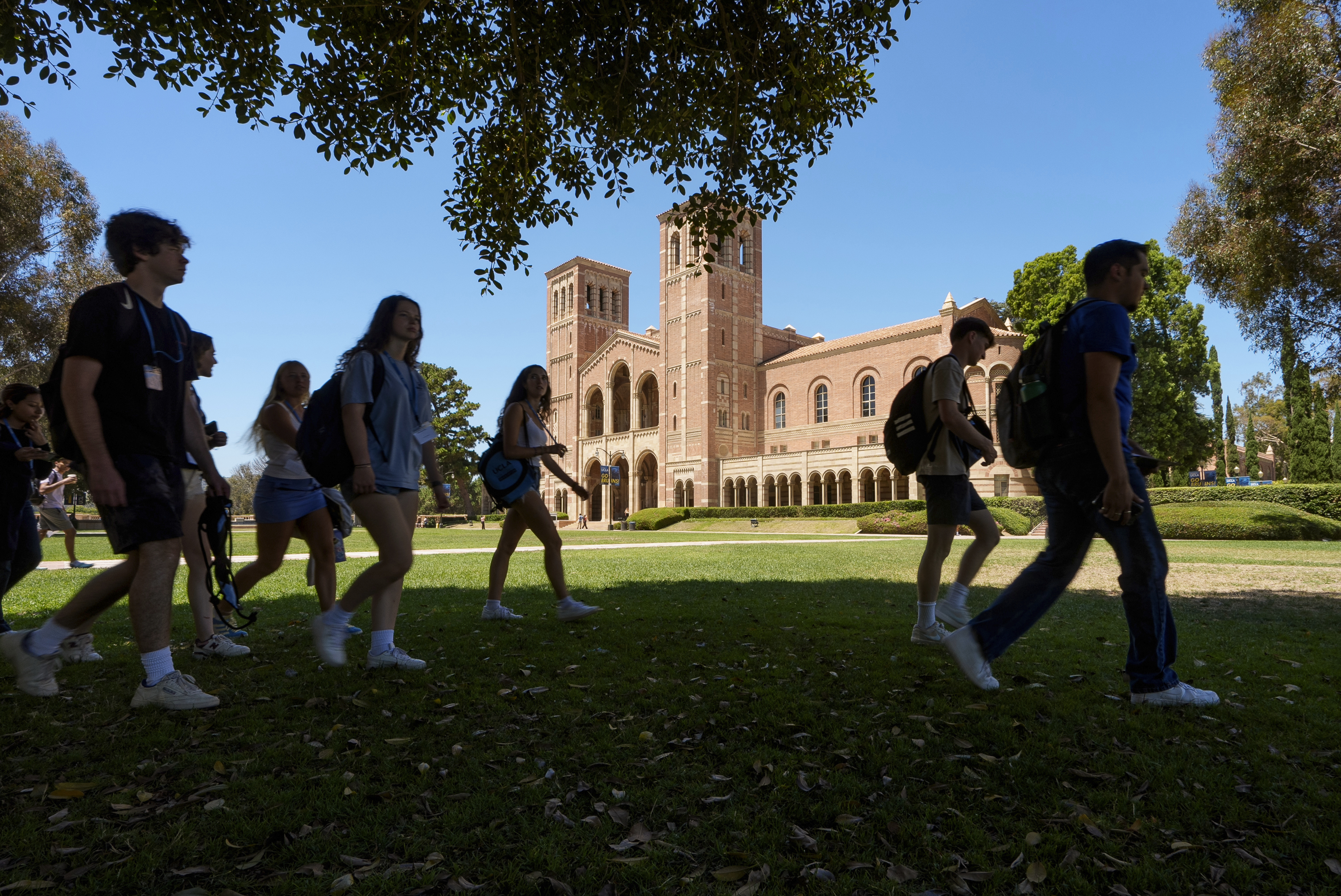 FILE - Students walk past Royce Hall at the University of California, Los Angeles, campus in Los Angeles, Aug. 15, 2024. (AP Photo/Damian Dovarganes, File)