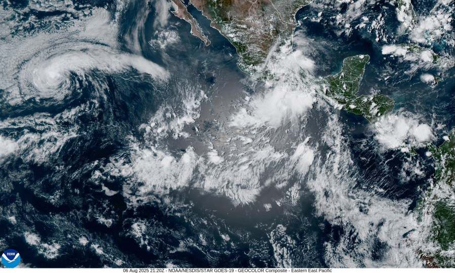 This satellite image from the National Oceanic and Atmospheric Administration taken at 5:20pm ET shows Tropical Storm Henriette, left, and Tropical Storm Ivo, center right, off the coast of southern Mexico in the eastern Pacific Ocean, on Wednesday, Aug. 6, 2025. (NOAA via AP)