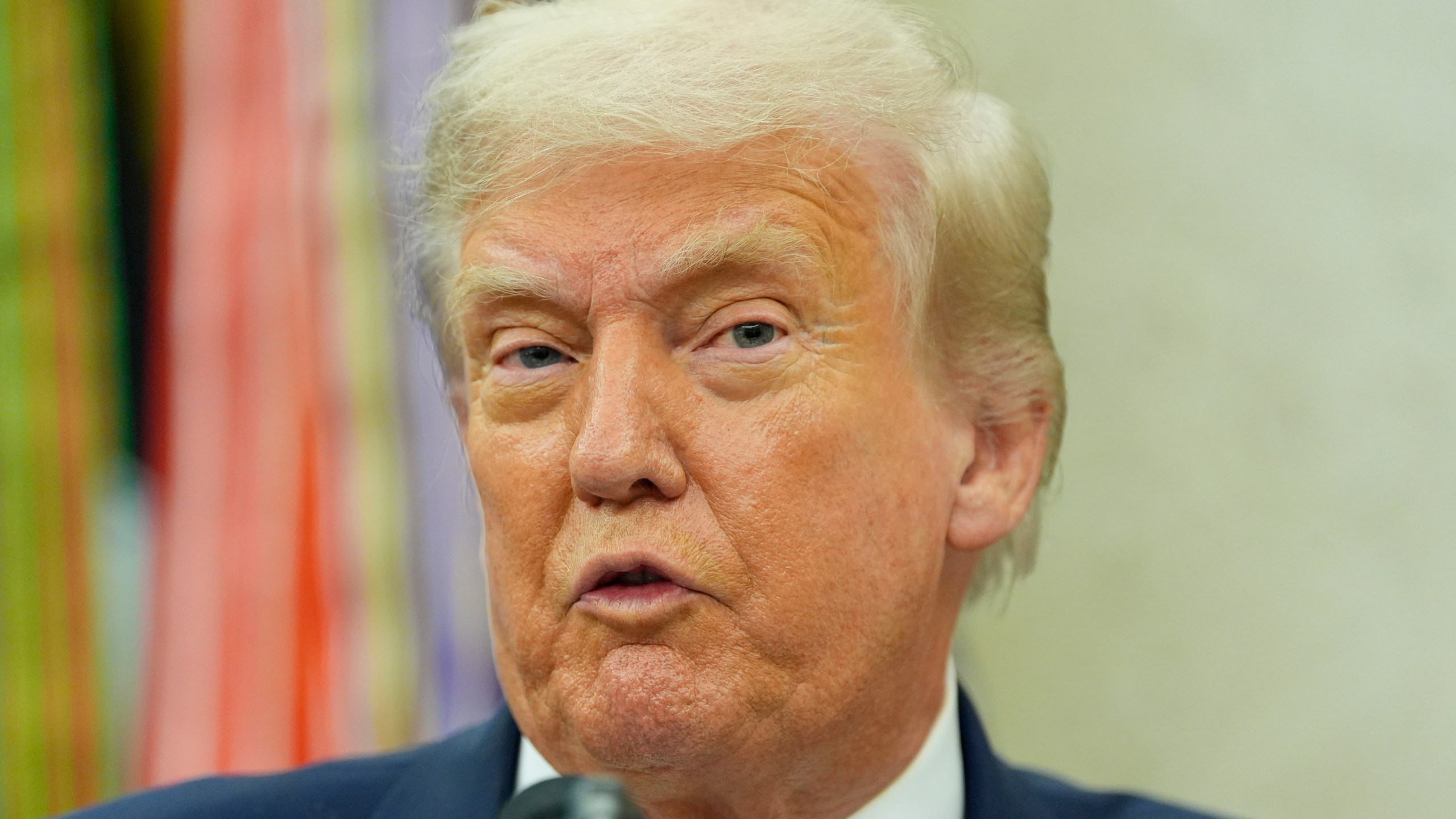 President Donald Trump makes an announcement about Apple in the Oval Office, Wednesday, Aug. 6, 2025, in Washington. (AP Photo/Alex Brandon)