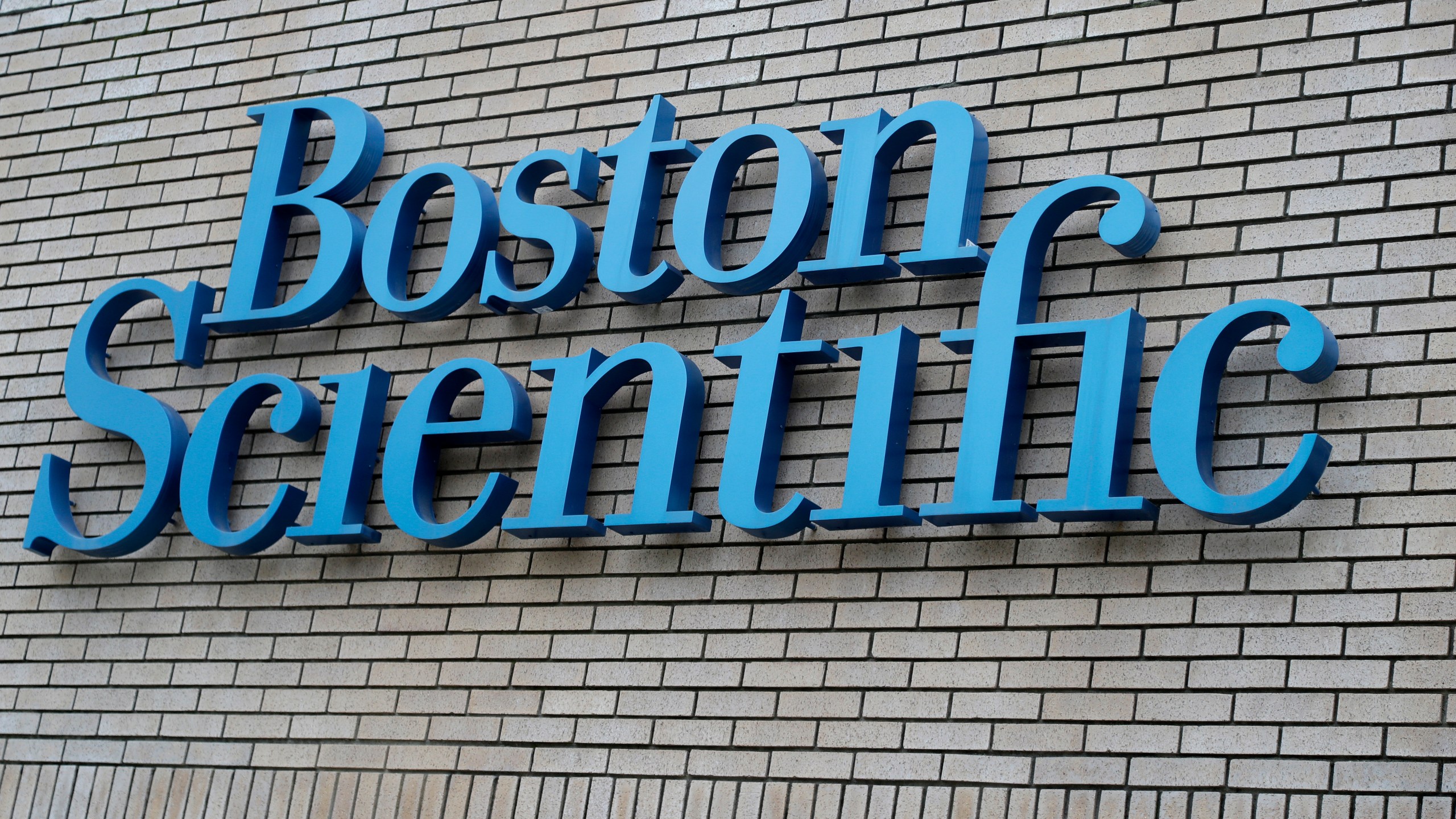 FILE - The Boston Scientific logo is seen at company offices in Fremont, Calif., Feb. 1, 2017. (AP Photo/Marcio Jose Sanchez, File)