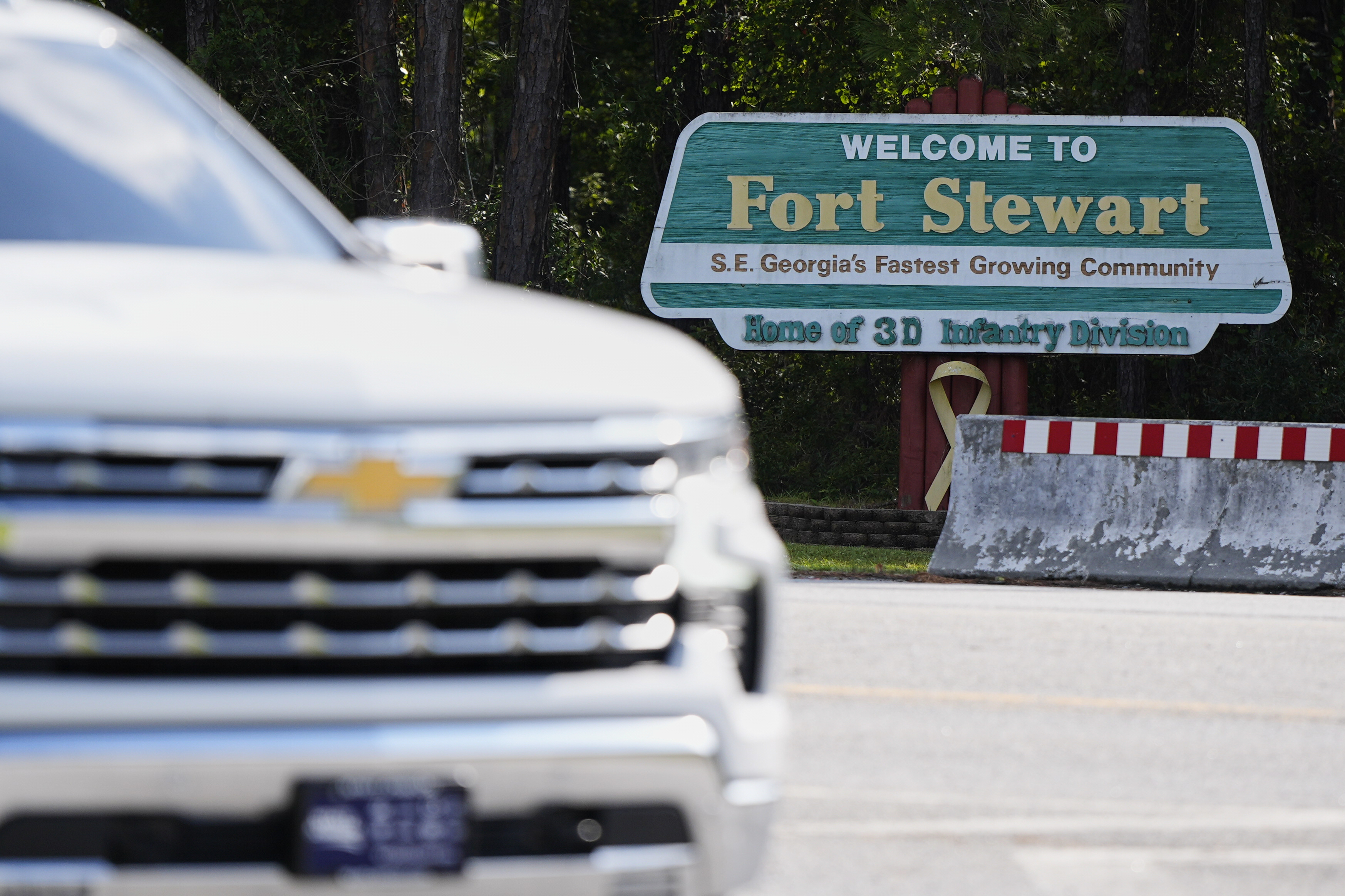 A sign welcoming people to Fort Stewart in Georgia is seen on Wednesday, Aug. 6, 2025. (AP Photo/Mike Stewart)