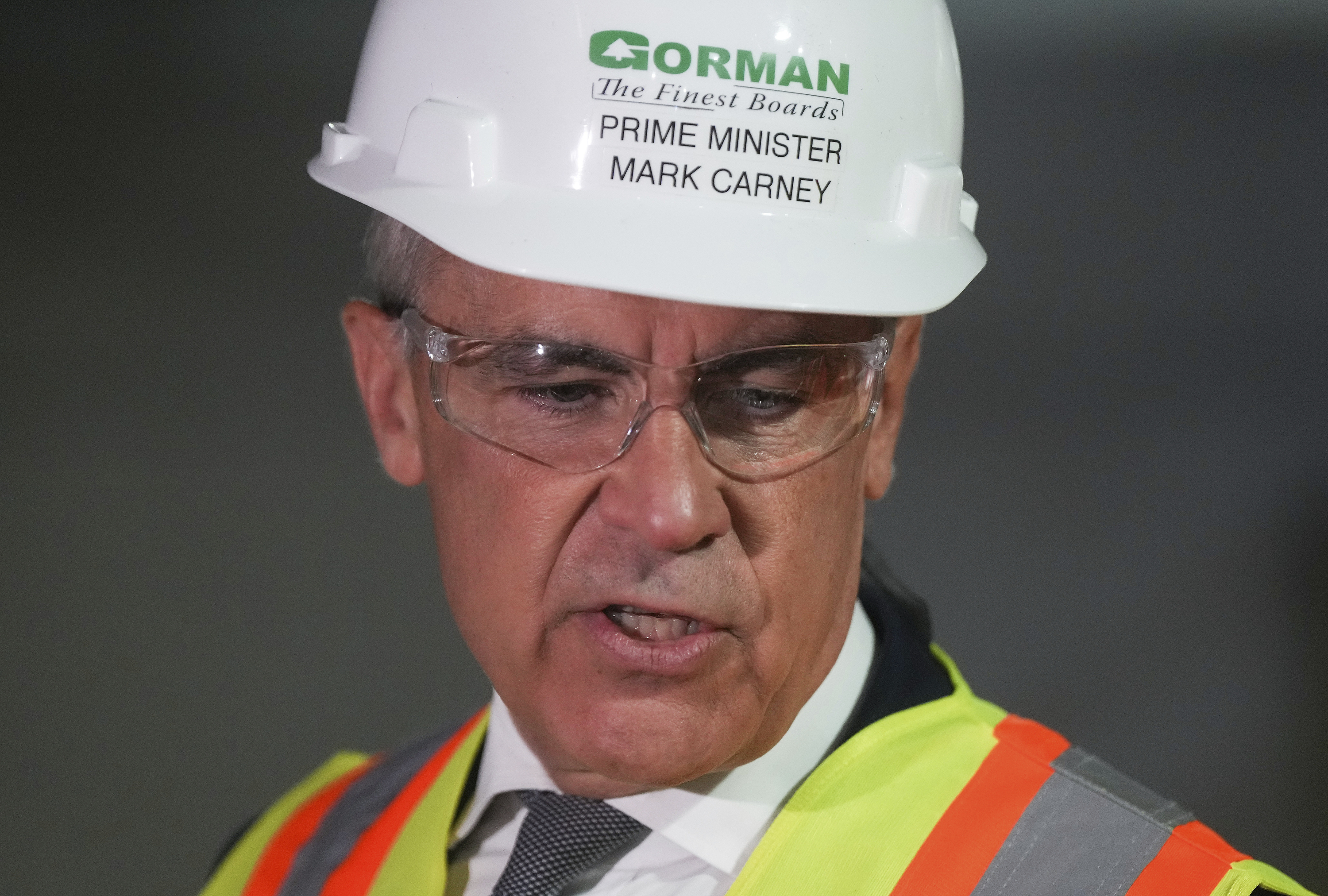 Prime Minister Mark Carney tours the Gorman Brothers Lumber sawmill in West Kelowna, B.C.,, on Tuesday, August 5, 2025. (Darryl Dyck /The Canadian Press via AP)