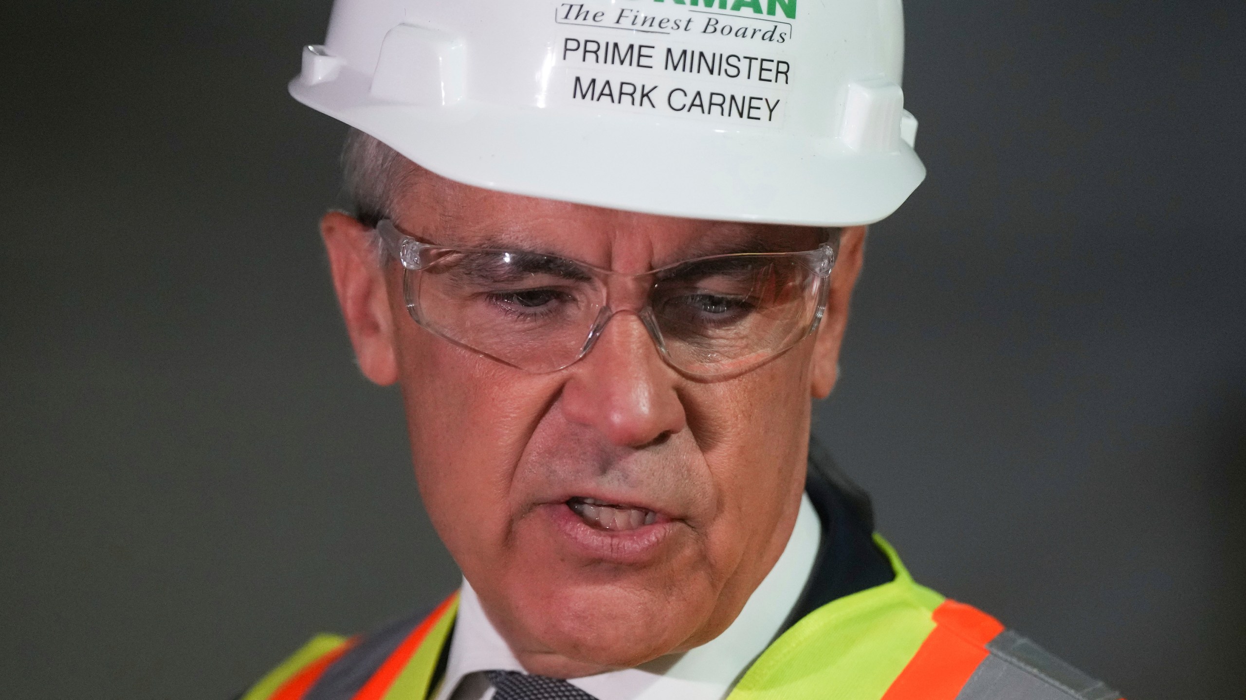 Prime Minister Mark Carney tours the Gorman Brothers Lumber sawmill in West Kelowna, B.C.,, on Tuesday, August 5, 2025. (Darryl Dyck /The Canadian Press via AP)