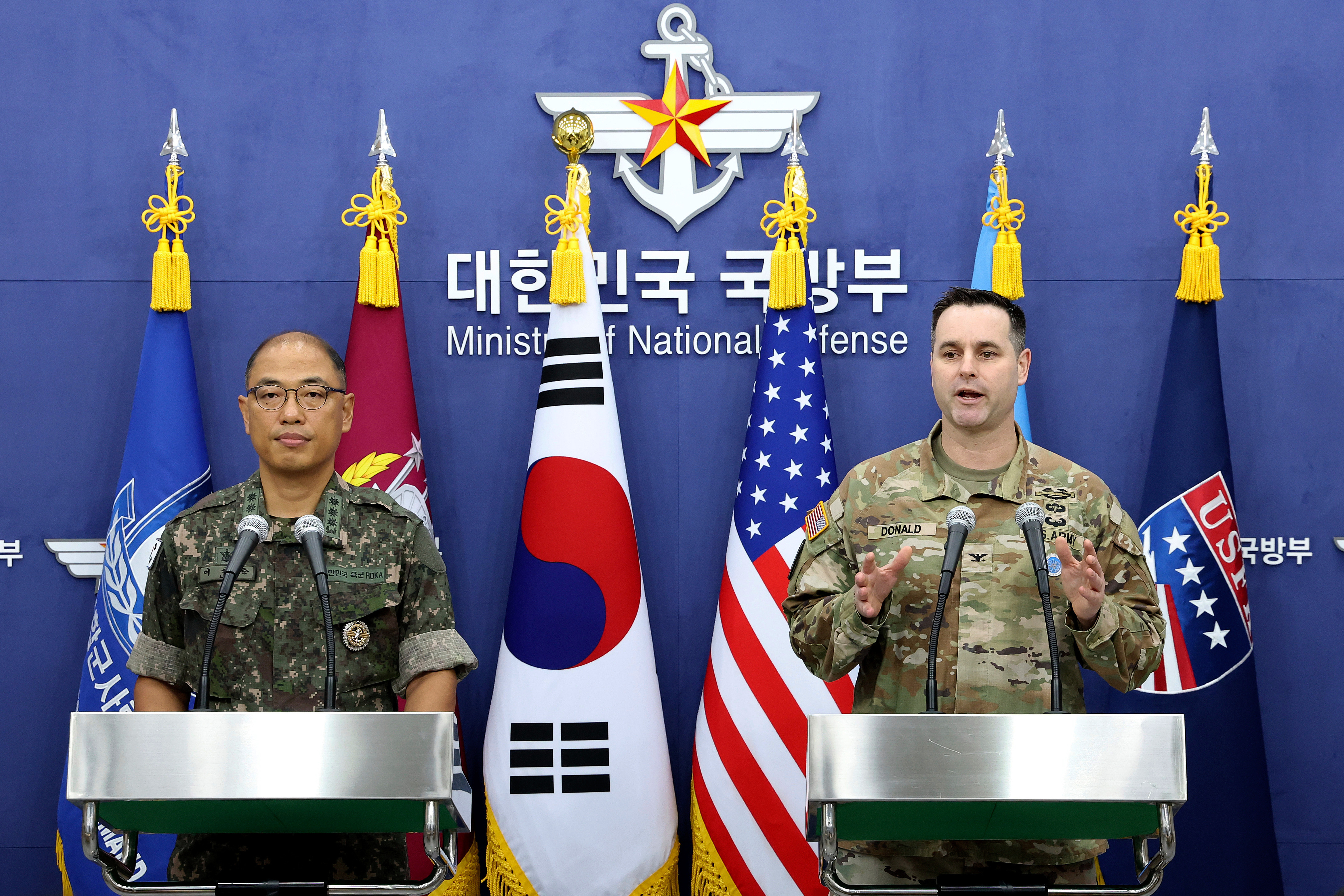 Col. Lee Sung-jun, left, public affairs director of South Korea's Joint Chiefs of Staff and Col. Ryan Donald, public affairs director of the United Nations Command (UNC), Combined Forces Command (CFC), and United States Forces Korea (USFK) attend a press briefing of Ulchi Freedom Shield 2025 exercise at the Defense Ministry in Seoul Thursday, Aug. 7, 2025. (Chung Sung-Jun/Pool Photo via AP)