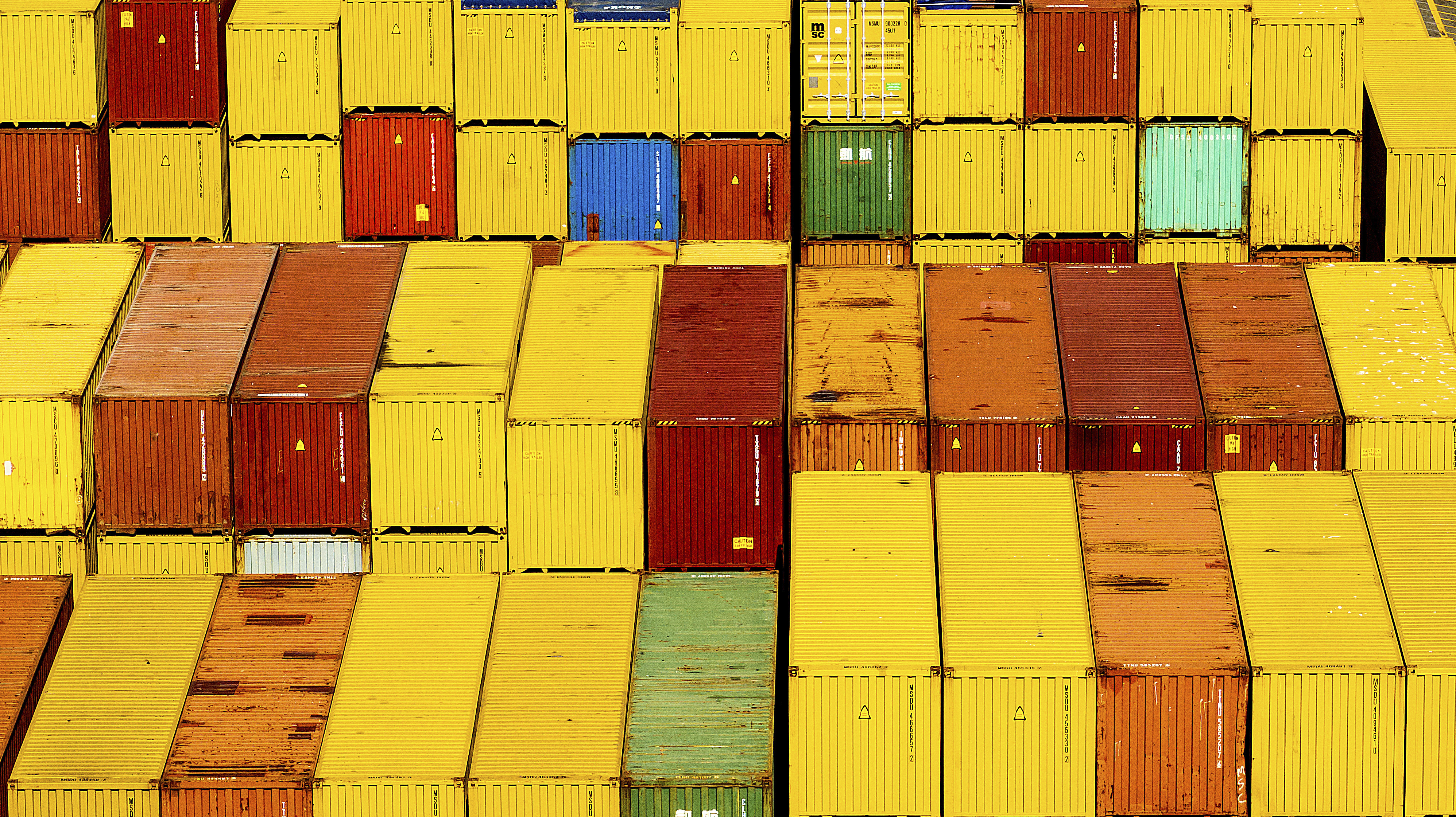 Cargo containers are seen at a shipping terminal at the Port of Oakland on Wednesday, Aug. 6, 2025, in Oakland, Calif. (AP Photo/Noah Berger)