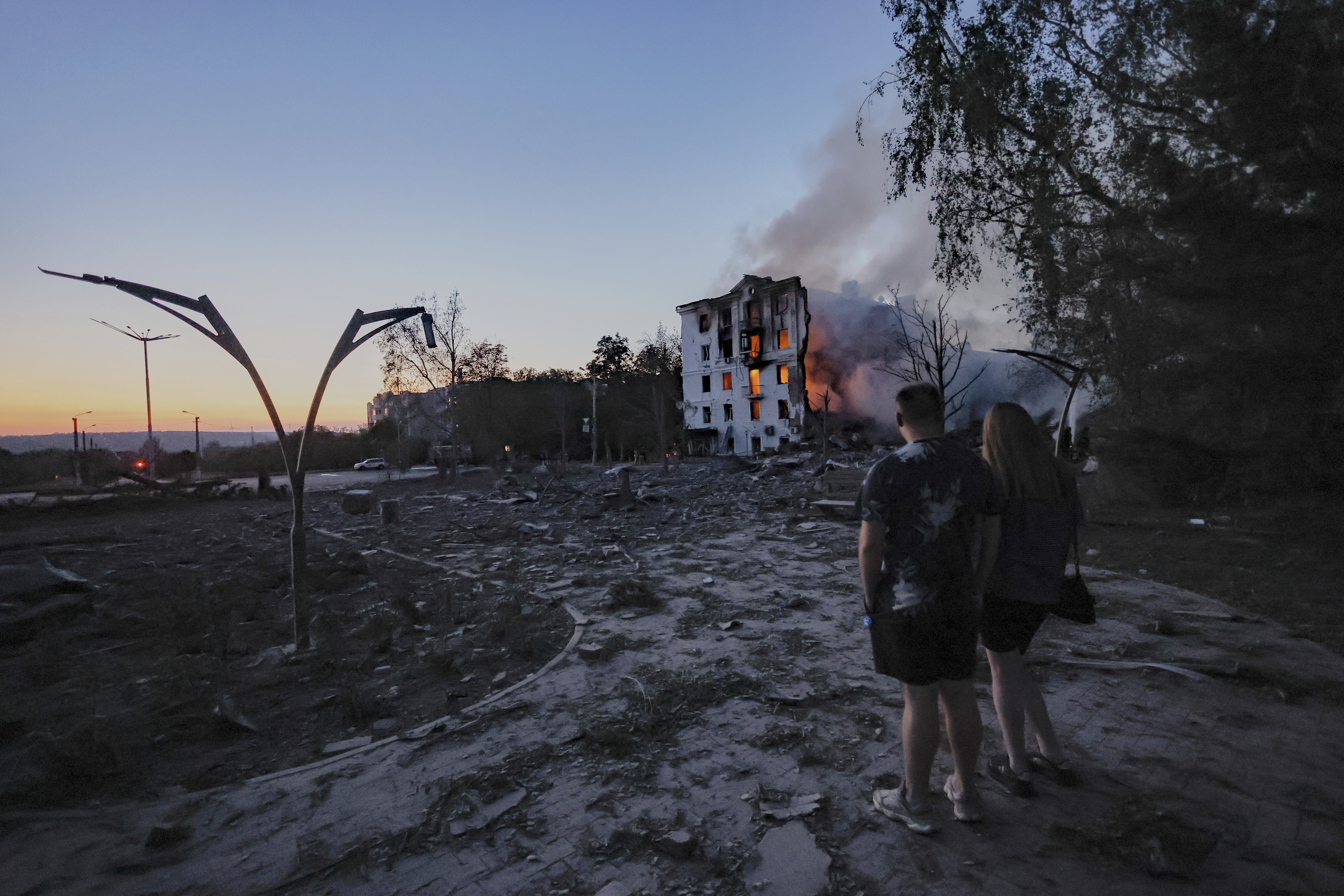 Locals look at a residential house destroyed by a Russian air strike in Kramatorsk, Ukraine, on Thursday, July 31, 2025. (AP Photo/Yevhen Titov)