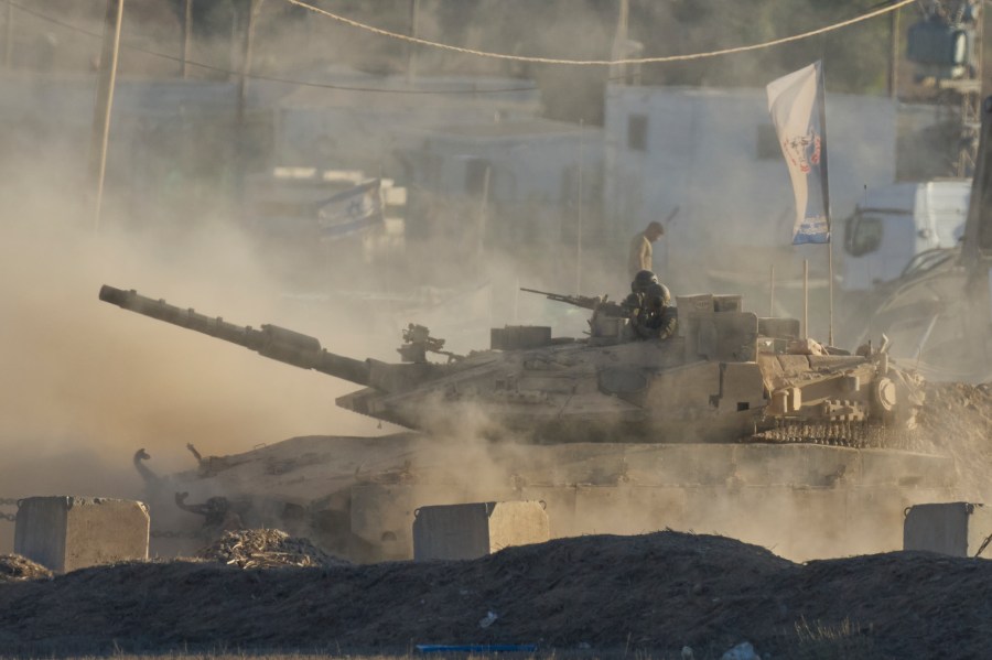 An Israeli tank moves near the border of the Gaza Strip in southern Israel, Wednesday, Aug. 6, 2025. (AP Photo/Ohad Zwigenberg)