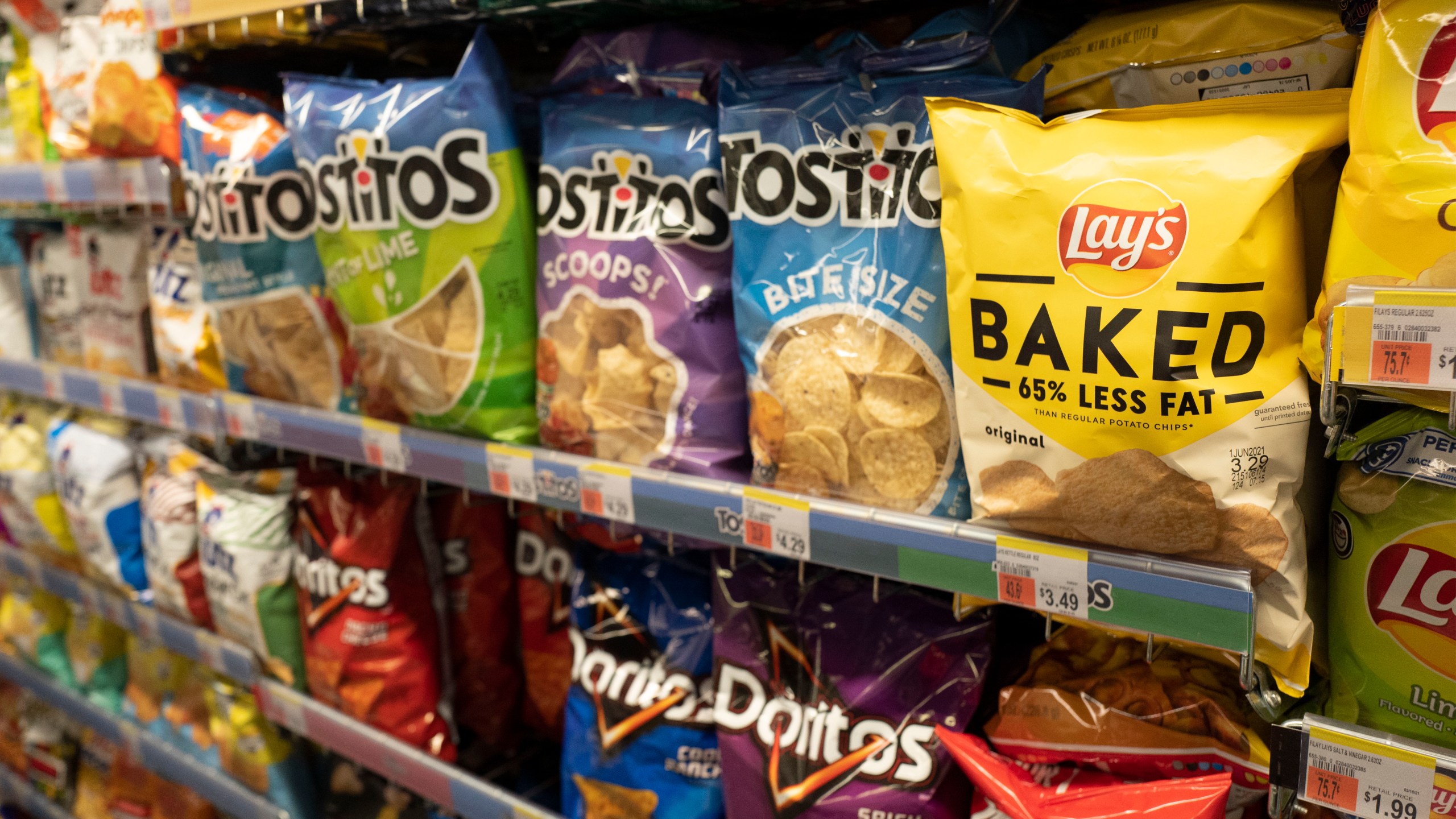 FILE - Potato chips are displayed at a store in New York, March 25, 2021. (AP Photo/Mark Lennihan, file)