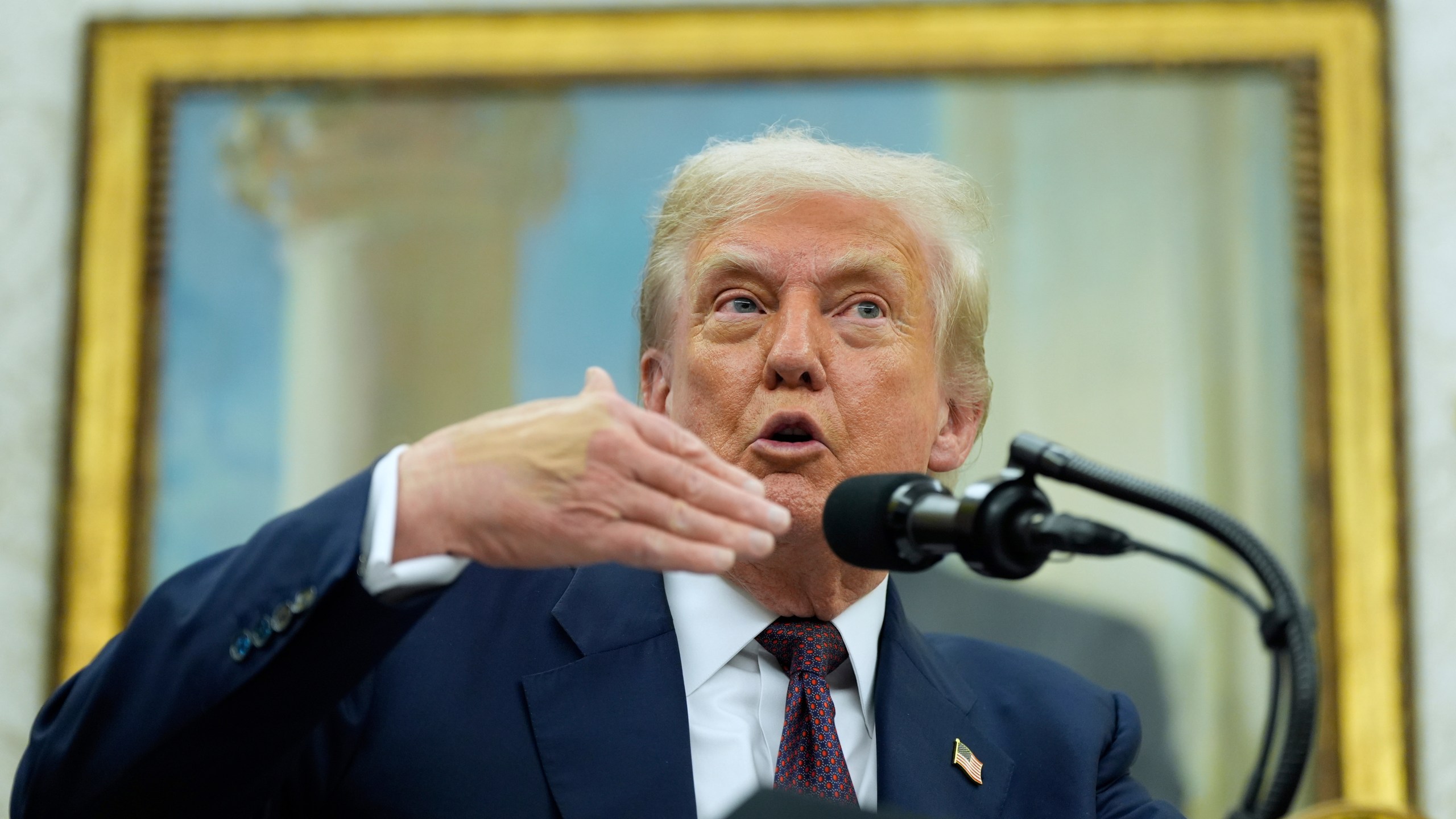 President Donald Trump makes an announcement about Apple with Apple CEO Tim Cook in the Oval Office, Wednesday, Aug. 6, 2025, in Washington. (AP Photo/Alex Brandon)