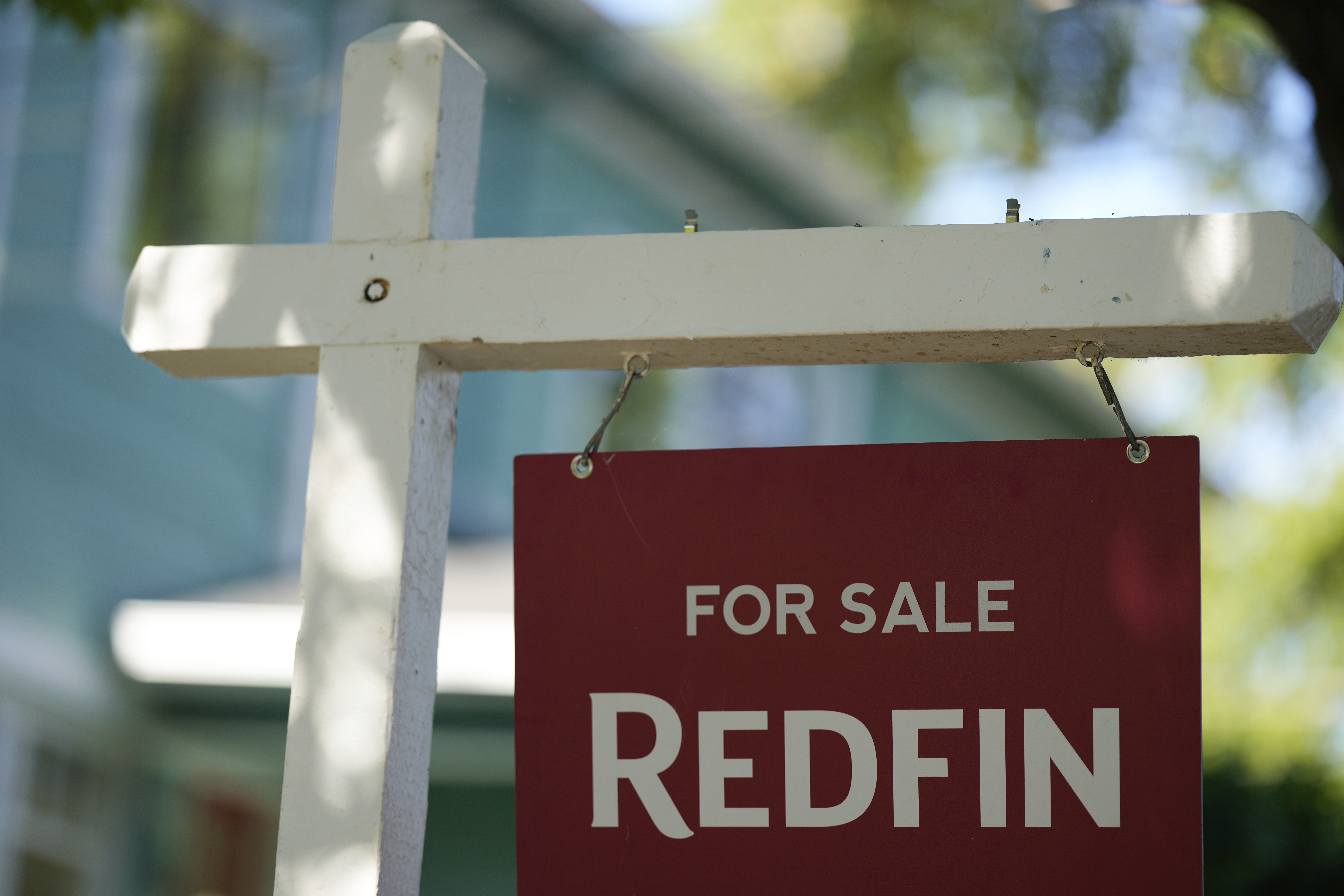 FILE - A "For Sale" sign is displayed outside a home on Friday, July 11, 2025, in Portland, Ore. (AP Photo/Jenny Kane, File)