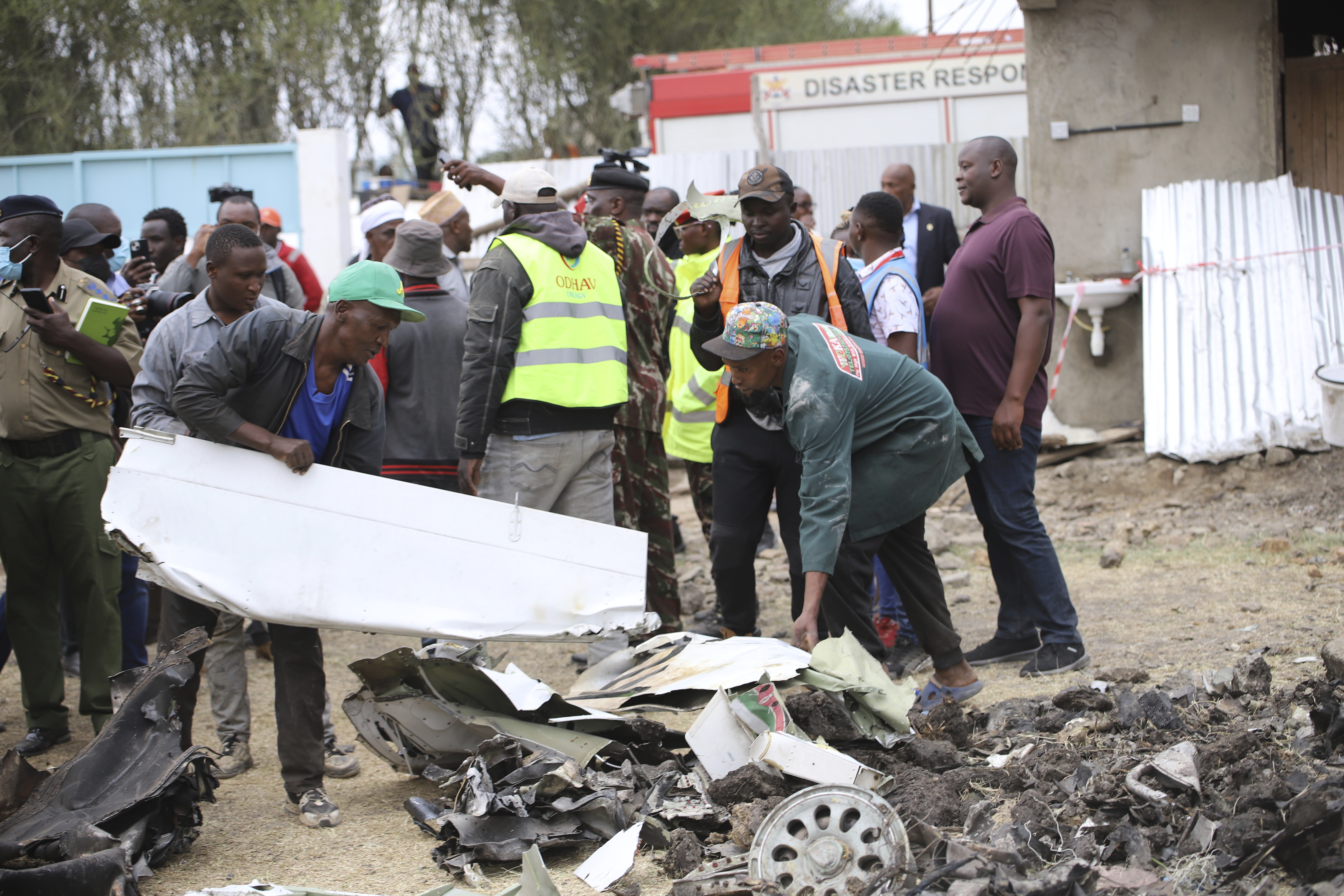 The debris of an airplane belonging to the African Medical and Research Foundation (AMREF) lies scattered after it crashed into a residential building in the Mwihoko area of Ruiru, in Kiambu County, Kenya, Thursday, Aug. 7, 2024. (AP Photo/Patrick Ngugi)