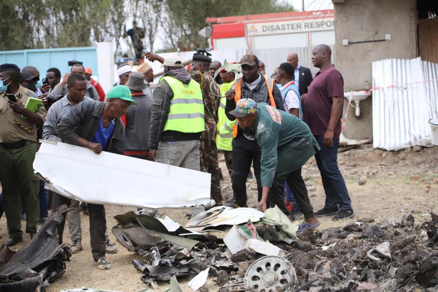 The debris of an airplane belonging to the African Medical and Research Foundation (AMREF) lies scattered after it crashed into a residential building in the Mwihoko area of Ruiru, in Kiambu County, Kenya, Thursday, Aug. 7, 2024. (AP Photo/Patrick Ngugi)