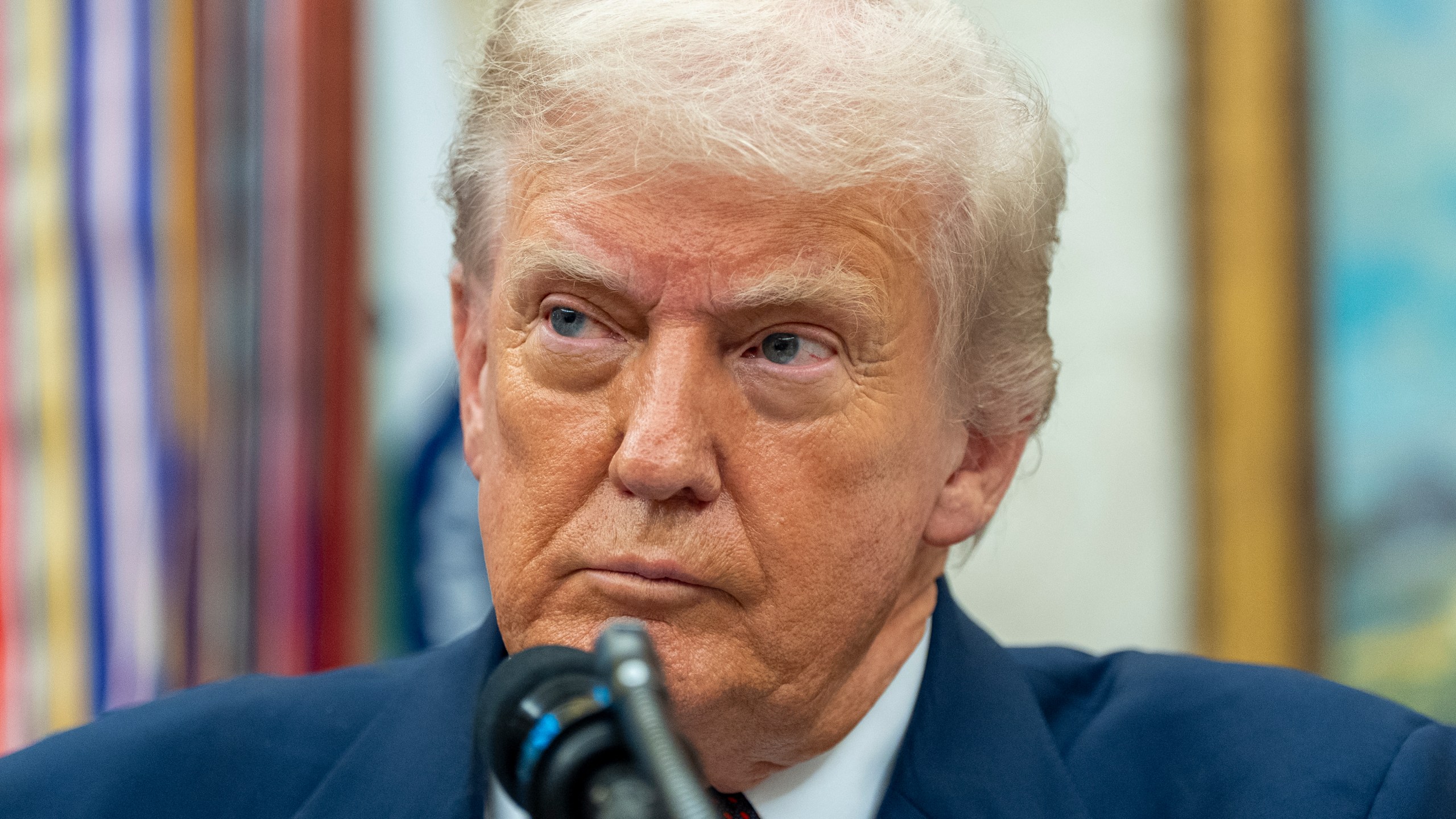 President Donald Trump pauses while speaking during an announcement about Apple with Apple CEO Tim Cook in the Oval Office, Wednesday, Aug. 6, 2025, in Washington. (AP Photo/Alex Brandon)
