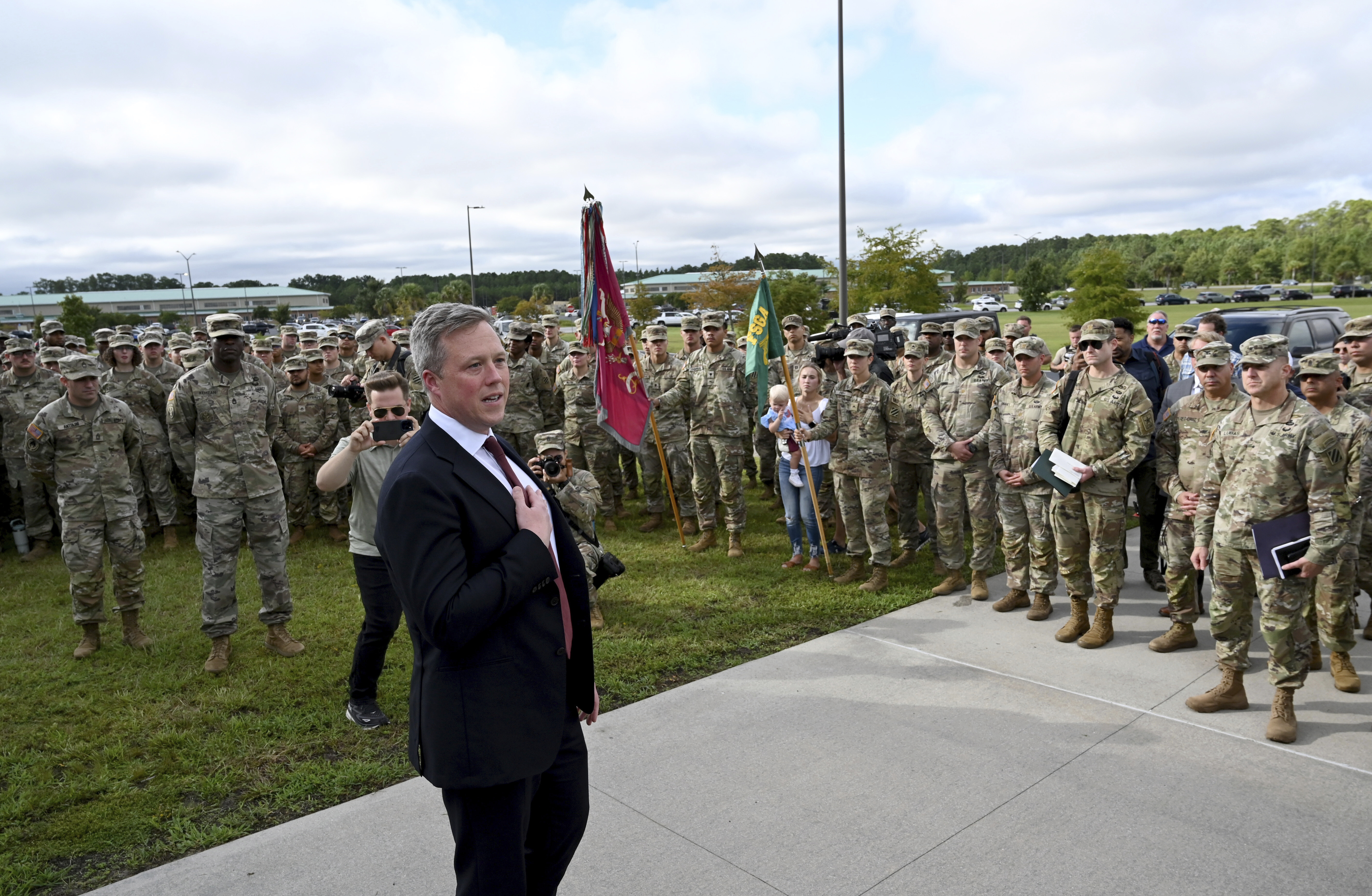 Army Secretary Dan Driscoll expresses his gratitude as he arrives to honor six soldiers for their heroic actions and for a news conference outside Fort Stewart in Georgia, Thursday, Aug. 6, 2025. (Hyosub Shin /Atlanta Journal-Constitution via AP)