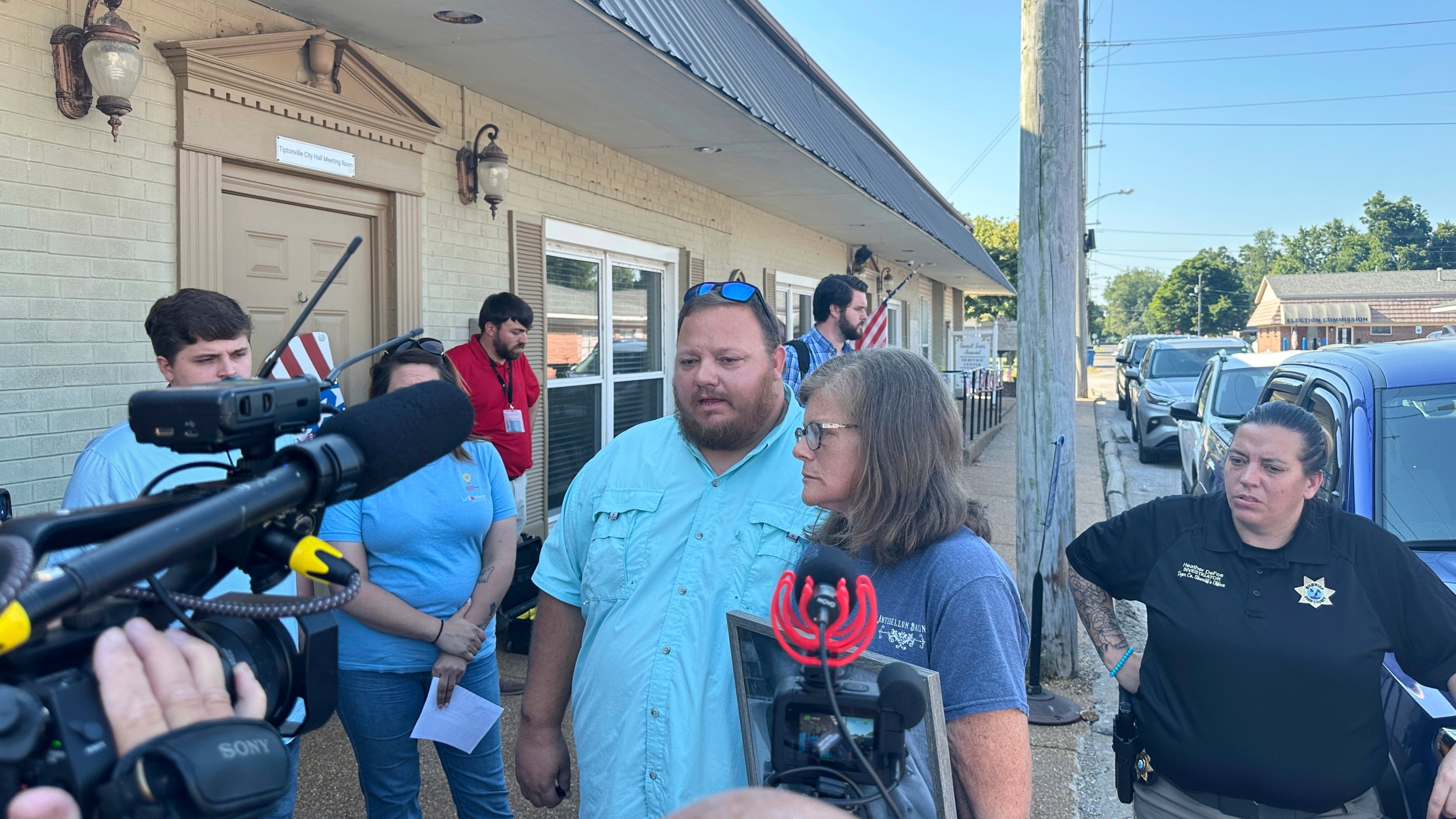 The parents of James M. Wilson, Matthew Wilson, left, and Kim Hamil, speak with reporters after a court hearing for a man charged with killing four people, Thursday, Aug. 7, 2025, in Tiptonville, Tenn. (AP Photo/Adrian Sainz)
