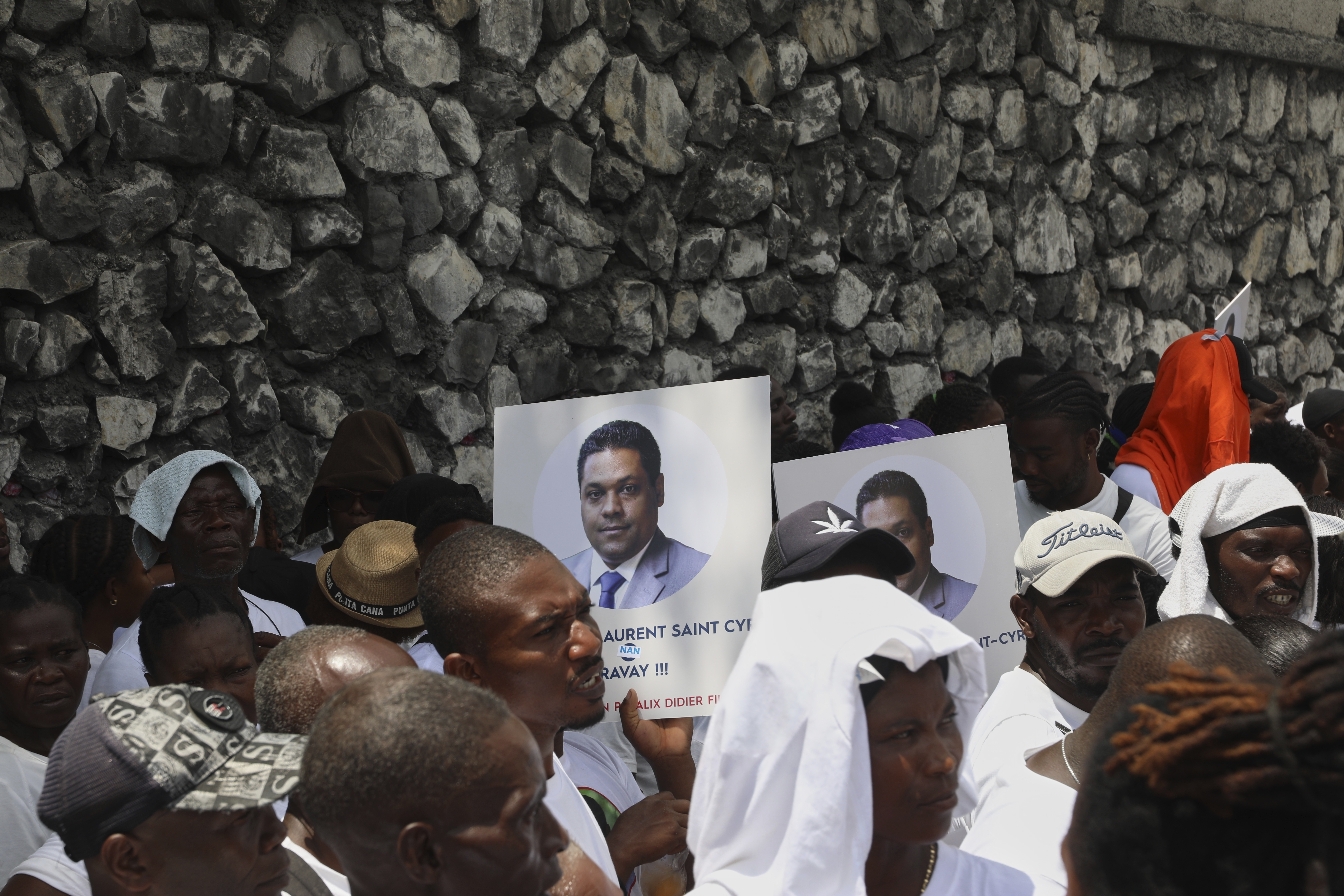 Supporters celebrate the installation of Laurent Saint-Cyr, who replaces Fritz Alphonse Jean, in the rotating presidency of the transitional presidential council in Port-au-Prince, Haiti, Thursday, Aug. 7, 2025. (AP Photo/Odelyn Joseph)