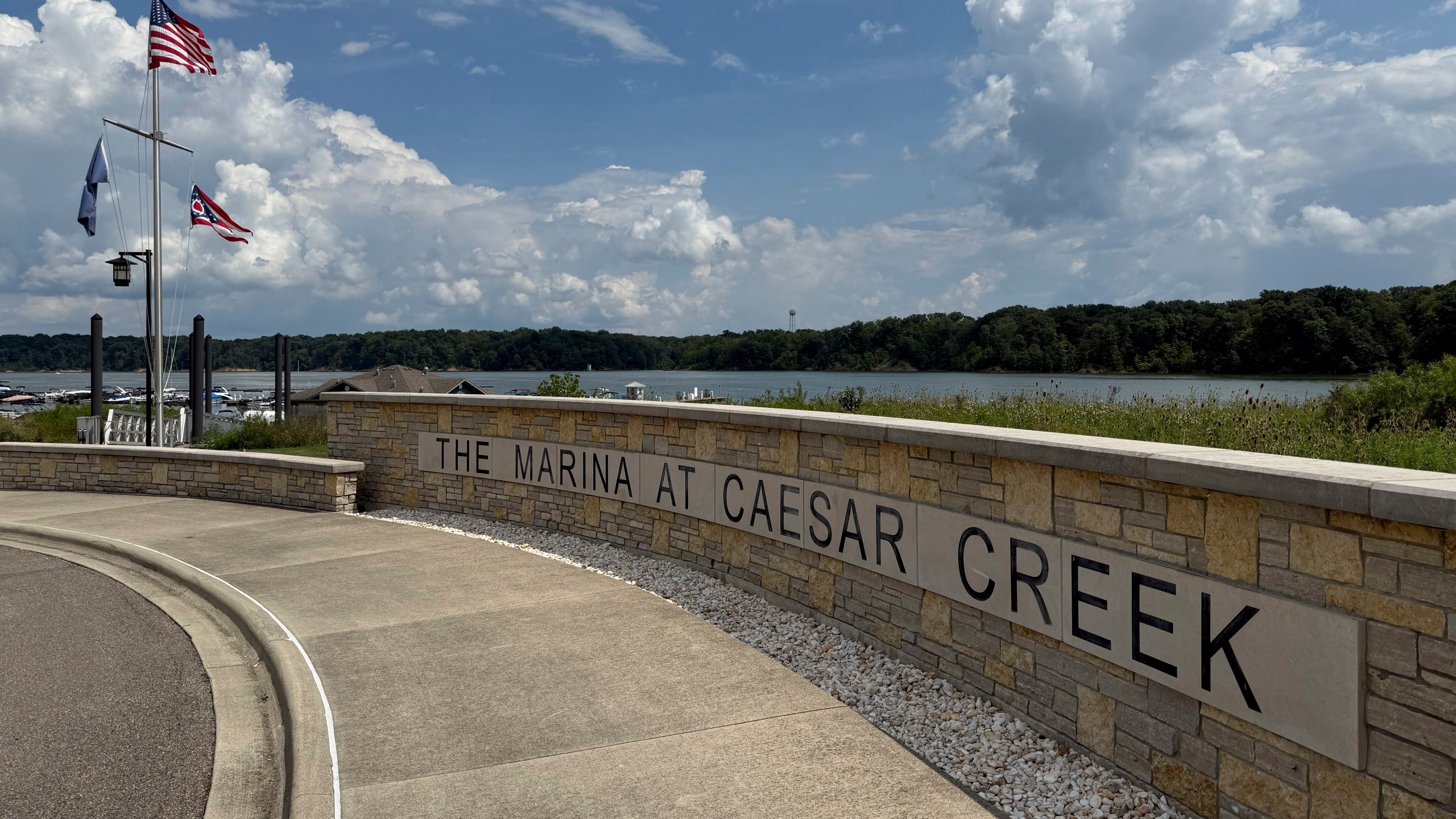 Flags fly at Caesar Creek Marina at Caesar Creek State Park in Waynesville, Ohio, Thursday, Aug. 7, 2025. (AP Photo/Patrick Aftoora-Orsagos)