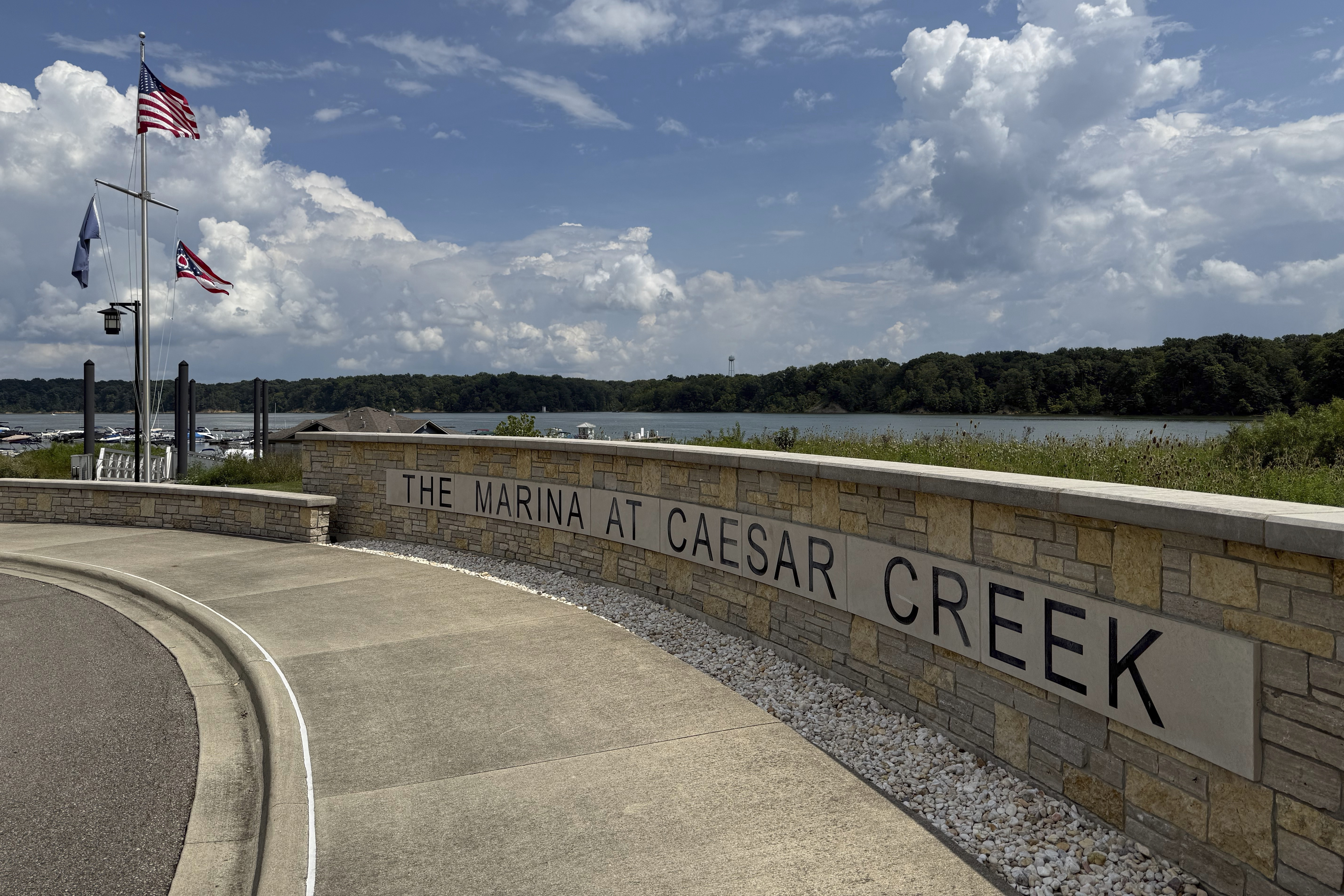 Flags fly at Caesar Creek Marina at Caesar Creek State Park in Waynesville, Ohio, Thursday, Aug. 7, 2025. (AP Photo/Patrick Aftoora-Orsagos)