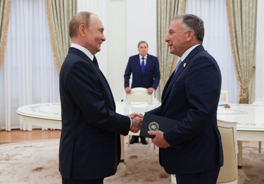 Russian President Vladimir Putin, left, and U.S. President Donald Trump's special envoy Steve Witkoff, right, shake hands during their meeting in Moscow, Russia, Wednesday, Aug. 6, 2025. (Gavriil Grigorov, Sputnik, Kremlin Pool Photo via AP)