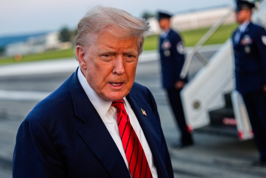 President Donald Trump speaks with reporters before boarding Air Force One at Lehigh Valley International Airport, Sunday, Aug. 3, 2025, in Allentown, Pa. (AP Photo/Julia Demaree Nikhinson)