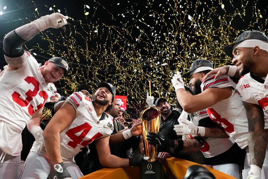 FILE - Ohio State celebrates after their win against Notre Dame in the College Football Playoff national championship game Jan. 20, 2025, in Atlanta. (AP Photo/Brynn Anderson, File)