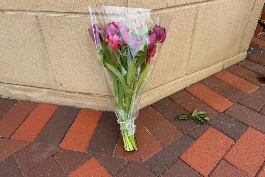A lone bouquet sits outside a CVS pharmacy on Saturday, Aug. 9, 2025, near where police say a man was shooting at the headquarters of the U.S. Centers for Disease Control and Prevention in Atlanta (AP Photo/Jeff Amy)