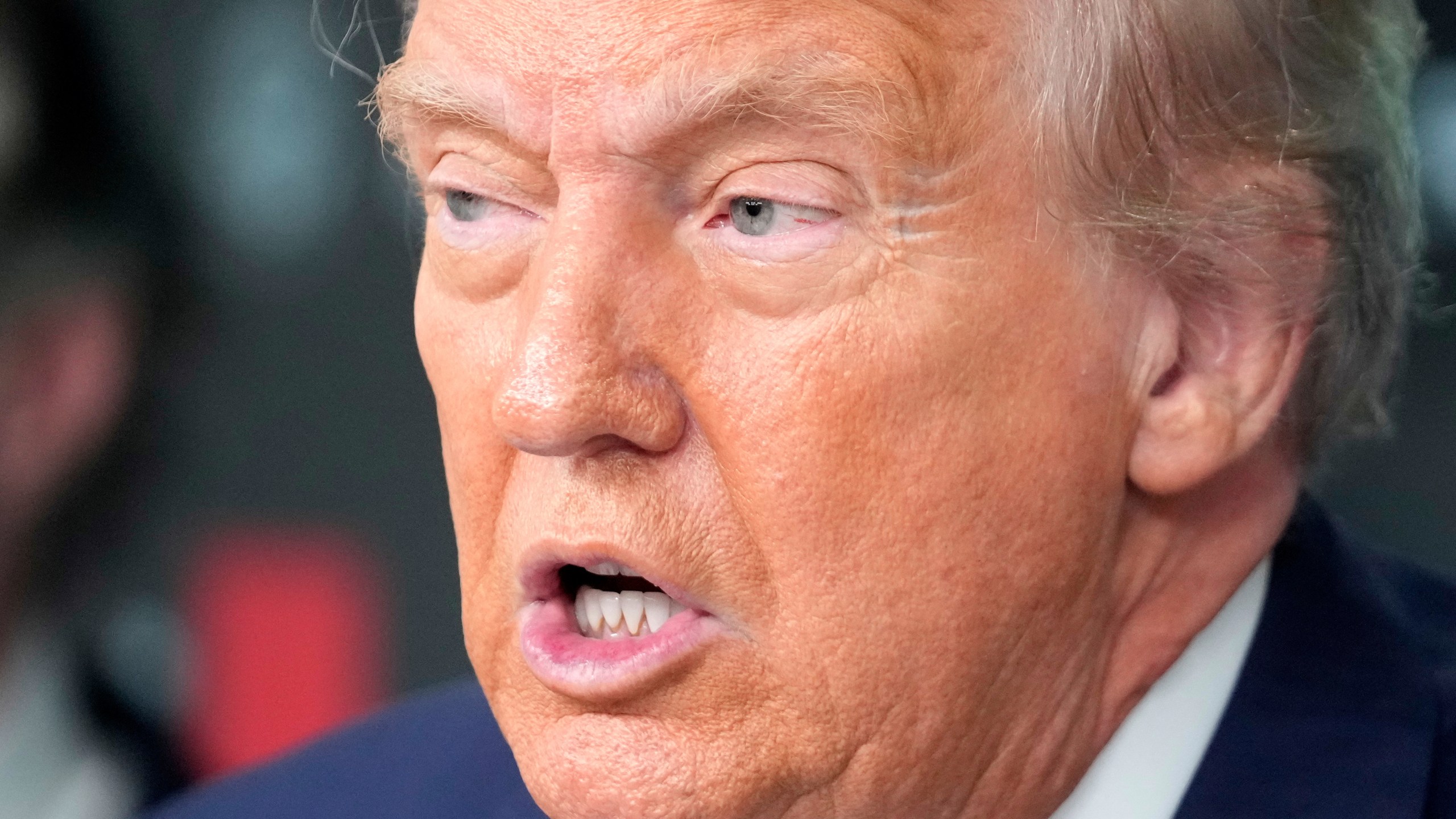 President Donald Trump speaks with reporters in the James Brady Press Briefing Room at the White House, Monday, Aug. 11, 2025, in Washington. (AP Photo/Mark Schiefelbein)