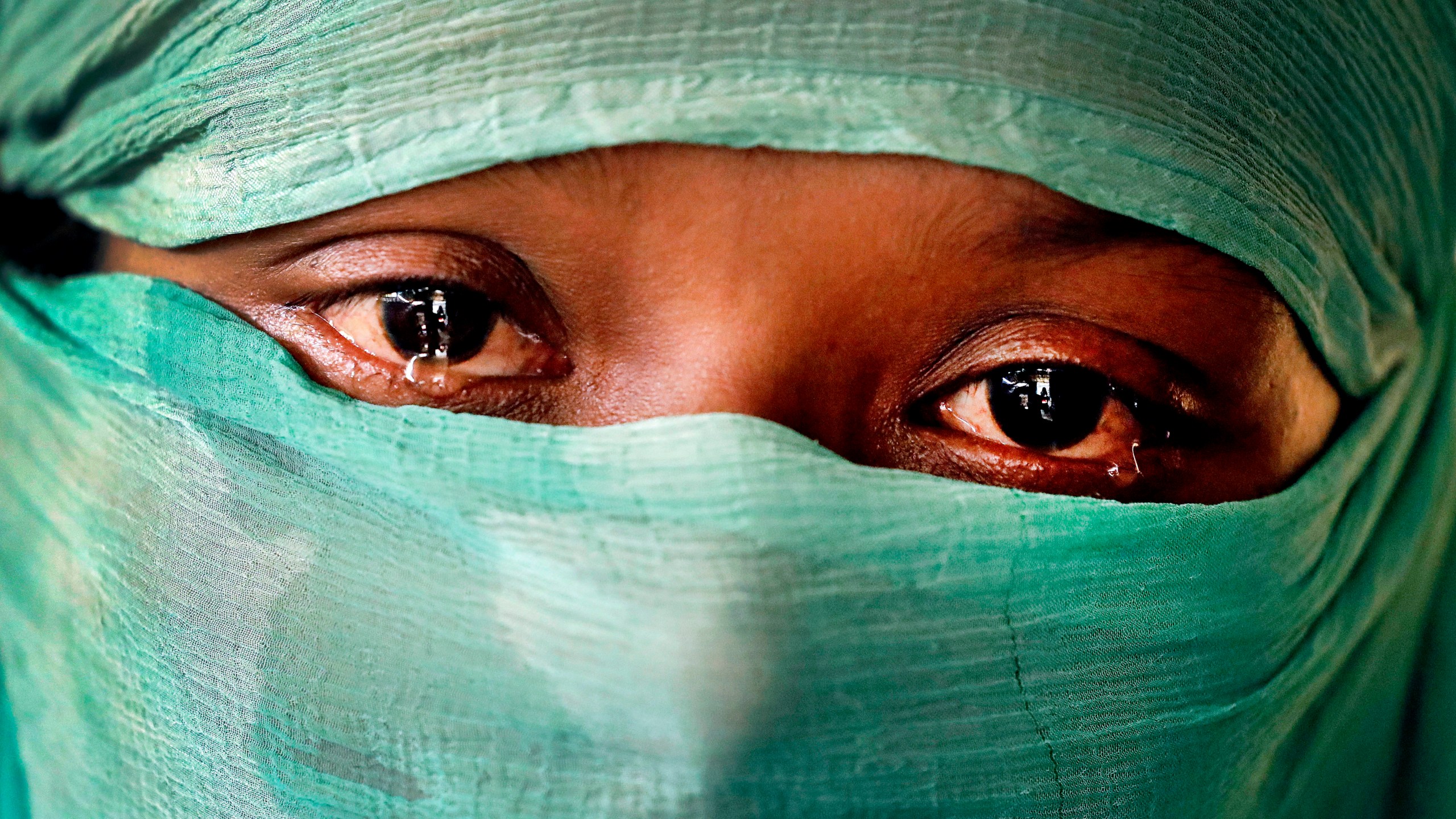 -FILE- In this Wednesday, Nov. 22, 2017, photo, F, 22, who says she was raped by members of Myanmar's armed forces in June and again in September, is photographed in her tent in Kutupalong refugee camp in Bangladesh. (AP Photo/Wong Maye-E, file)