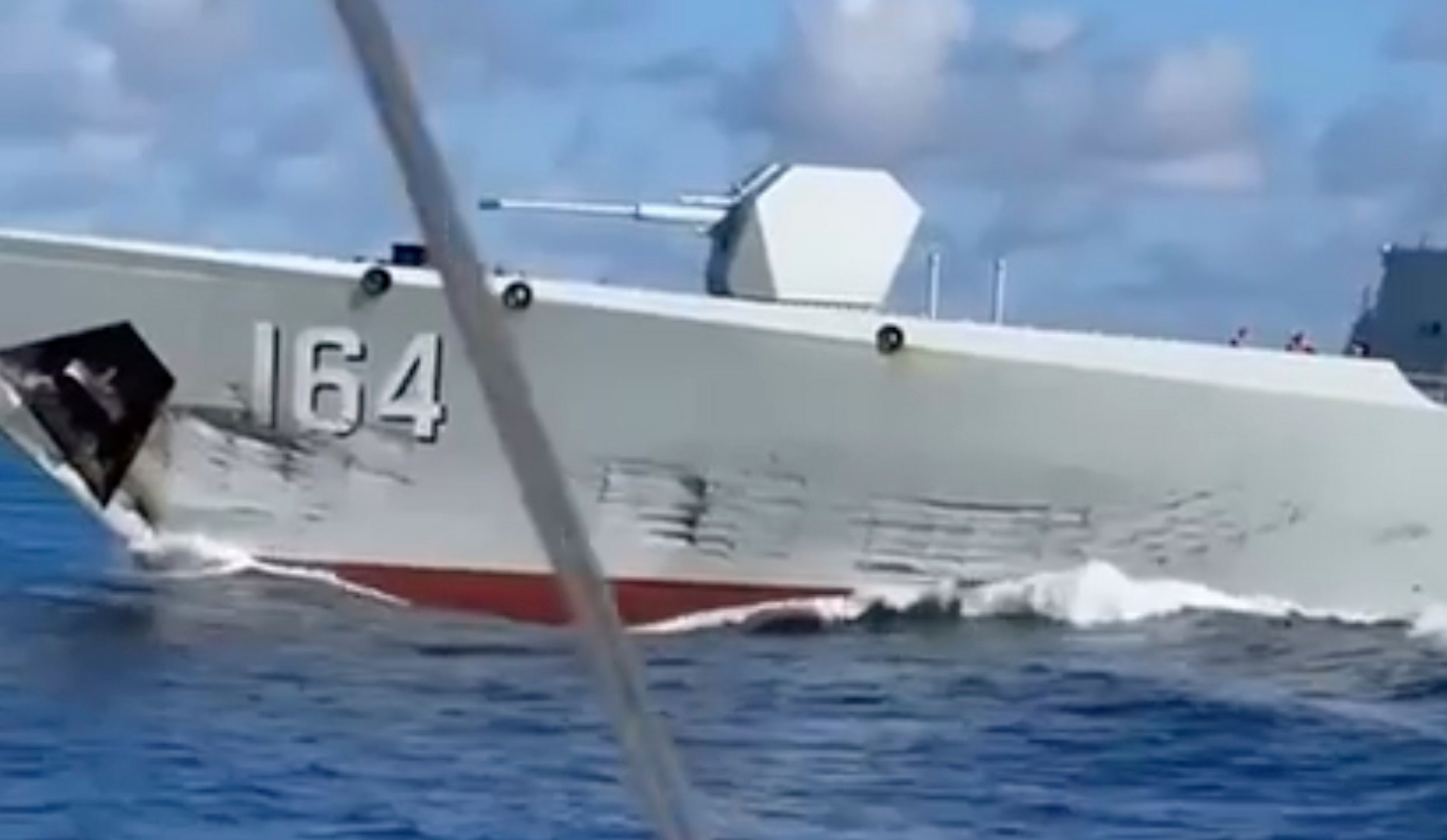 In this photo, taken from video and provided by the Philippine Coast Guard, a damaged Chinese Navy ship after an accidental collision with a Chinese Coast Guard vessel while chasing a Philippine fisheries boat near Scarborough Shoal in the disputed South China Sea on Monday Aug. 11, 2025. (Philippine Coast Guard via AP)