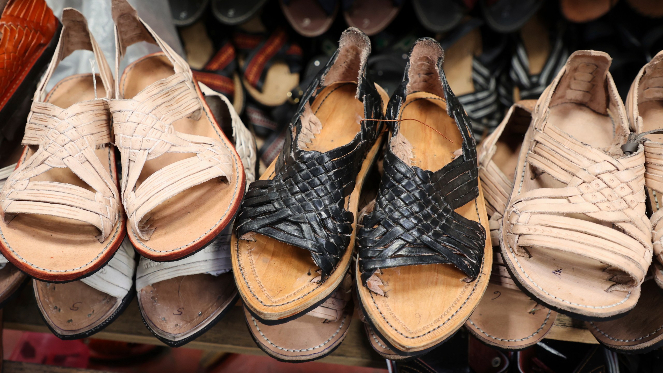 Sandals known as "huaraches" are displayed for sale at a market in Oaxaca, Mexico, Friday, Aug. 8, 2025. (AP Photo/Luis Alberto Cruz)