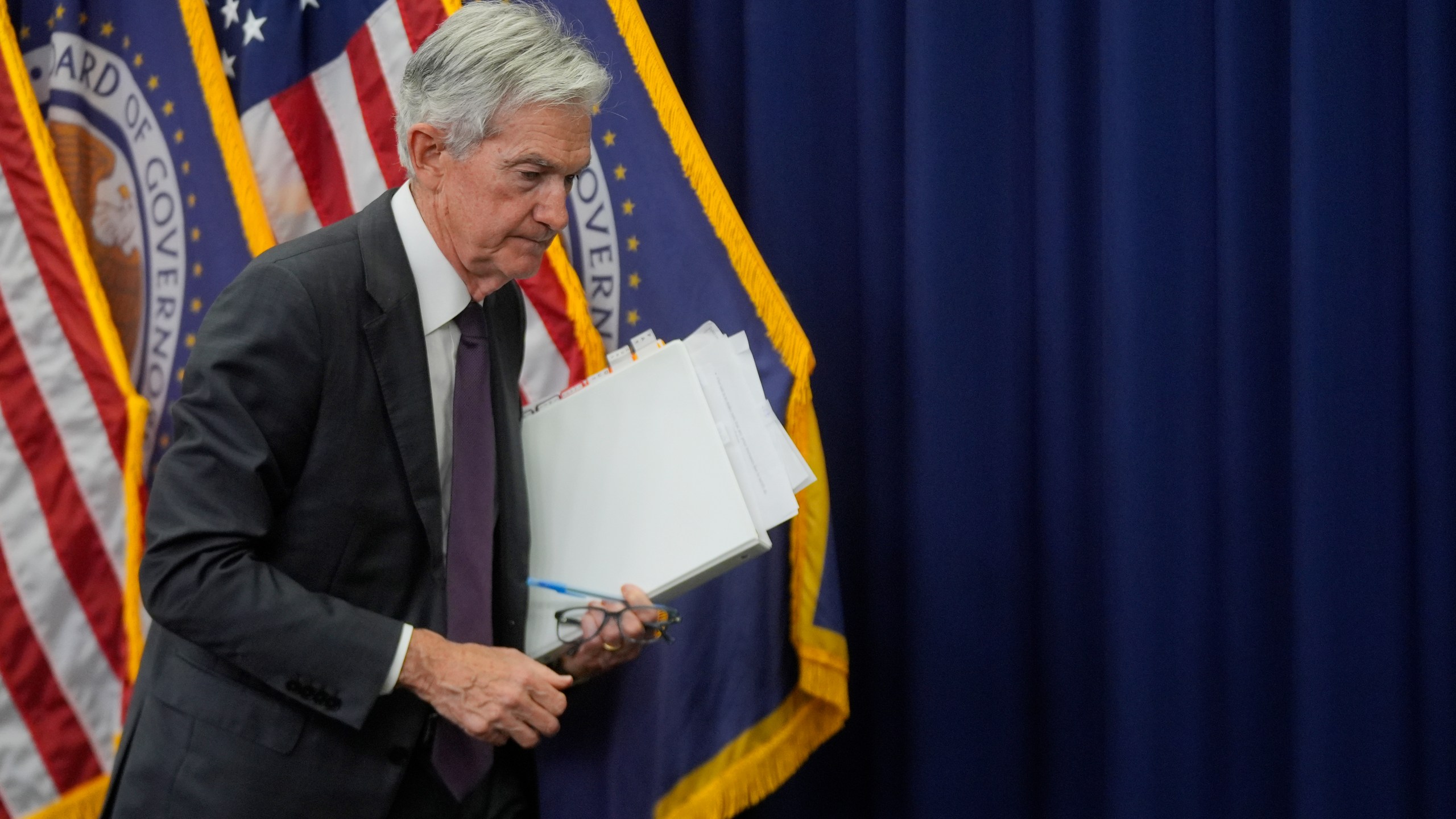 Federal Reserve Chairman Jerome Powell walks off after speaking during a news conference following the Federal Open Market Committee meeting, Wednesday, July 30, 2025, in Washington. (AP Photo/Manuel Balce Ceneta)
