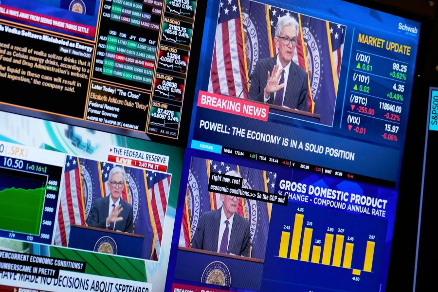 Televisions display Fed chairman Jerome Powell speaking on the floor at the New York Stock Exchange in New York, Wednesday, July 30, 2025. (AP Photo/Seth Wenig)
