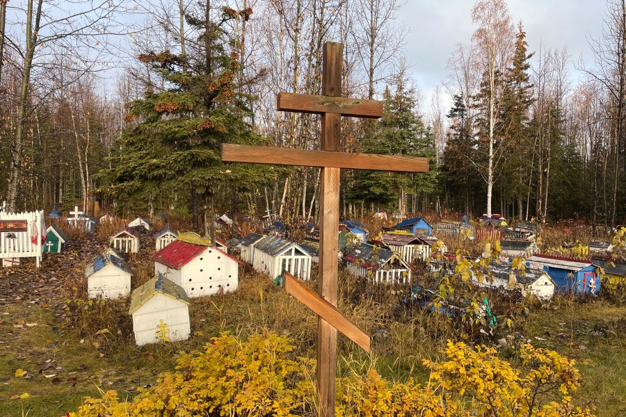 FILE - The cemetery at St. Nicholas Church in Eklutna, Alaska, features a mixture of Russian Orthodox conventions like crosses featuring three cross beams and the Dena'ina Athabascan tradition of erecting spirit homes above the graves, on Oct. 13, 2023. (AP Photo/Mark Thiessen, File)
