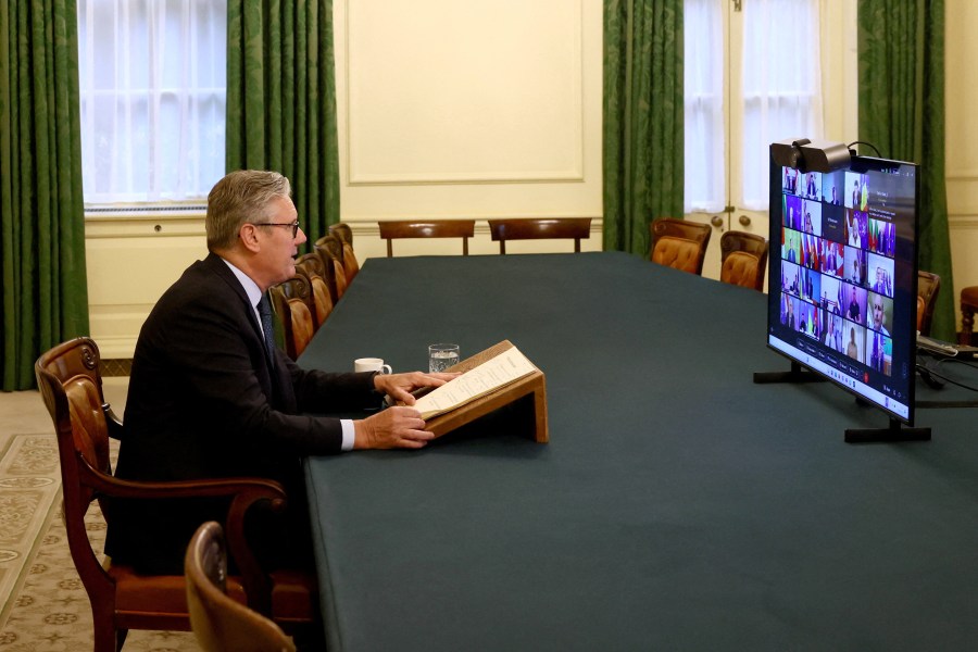 Britain's Prime Minister Keir Starmer co-chairs a videoconference call with European leaders on Ukraine, in London, Wednesday, Aug. 13, 2025. (Jack Taylor/Pool Photo via AP)